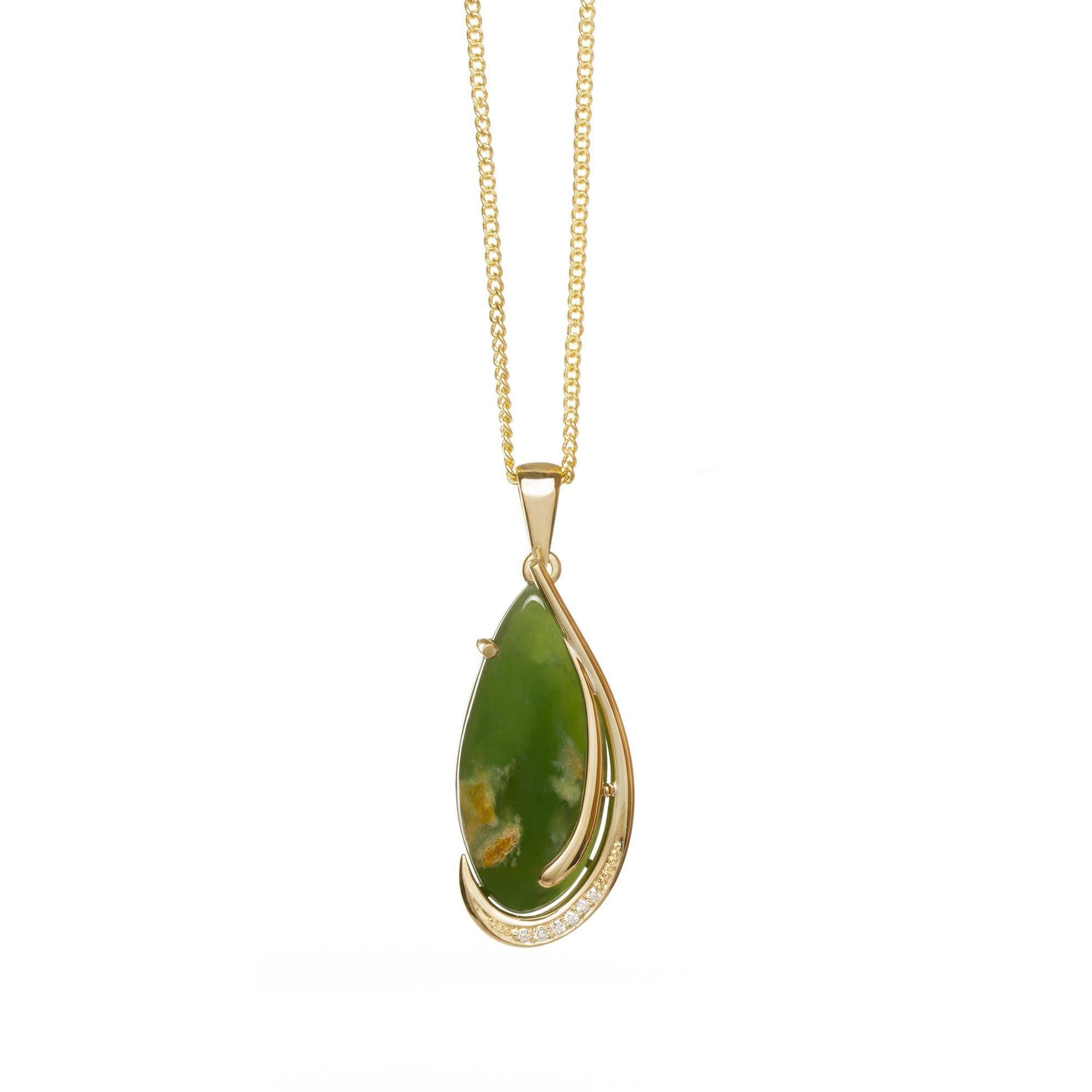 
A truly high end piece of jewellery. Crafted from New Zealand pounamu set in 18ct yellow gold. With 6 diamonds, totalling 0.06ct, it's a pendant with great value of precious stones. 

Taking the traditional and setting it on a modern gold chain