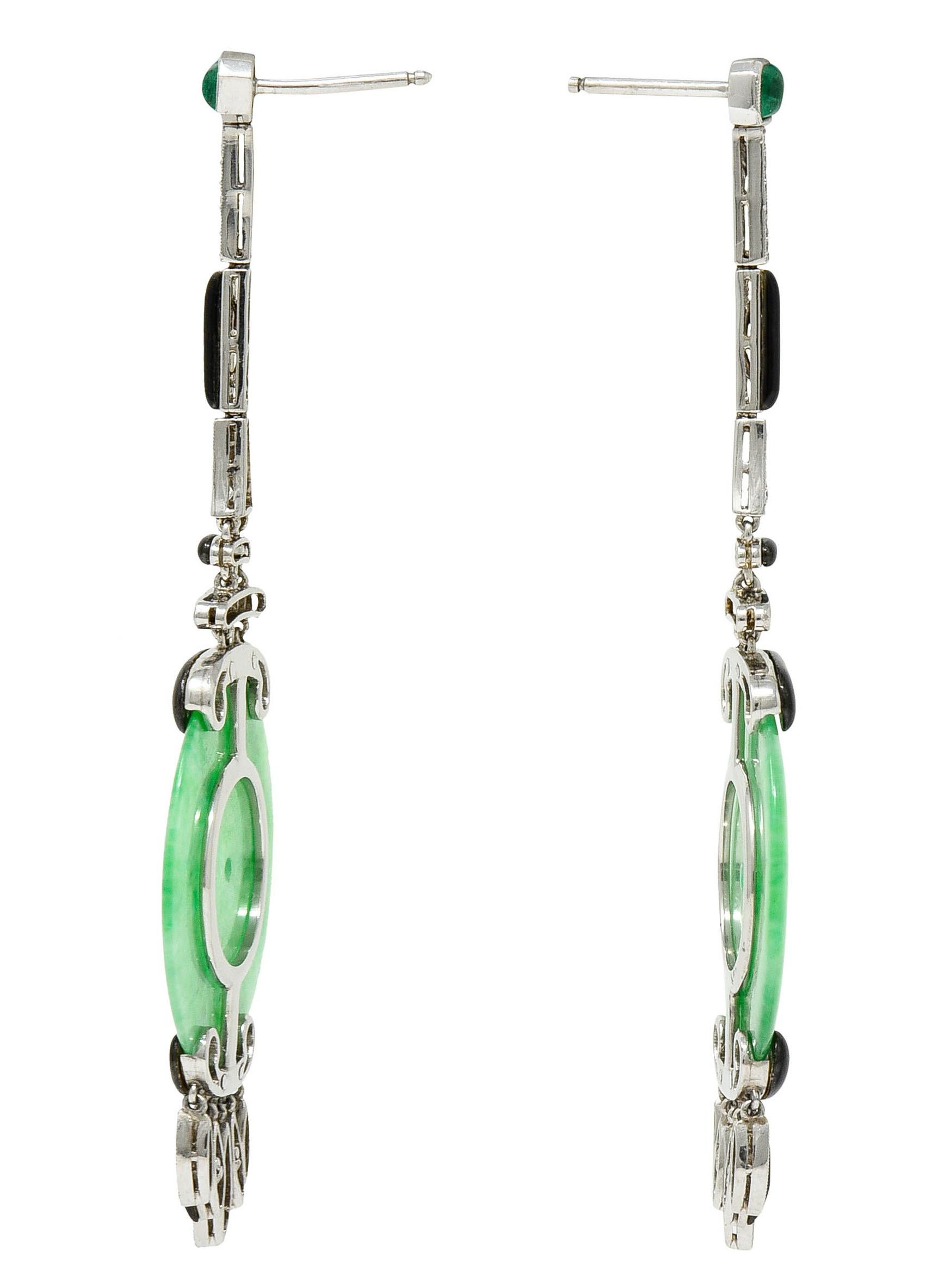 Art Deco style earrings with surmounts bezel set with emerald cabochons

Sugarloaf cut and blueish green in color while weighing in total approximately 0.30 carat

Accented by round brilliant cut diamonds weighing in total approximately 1.00 carat -