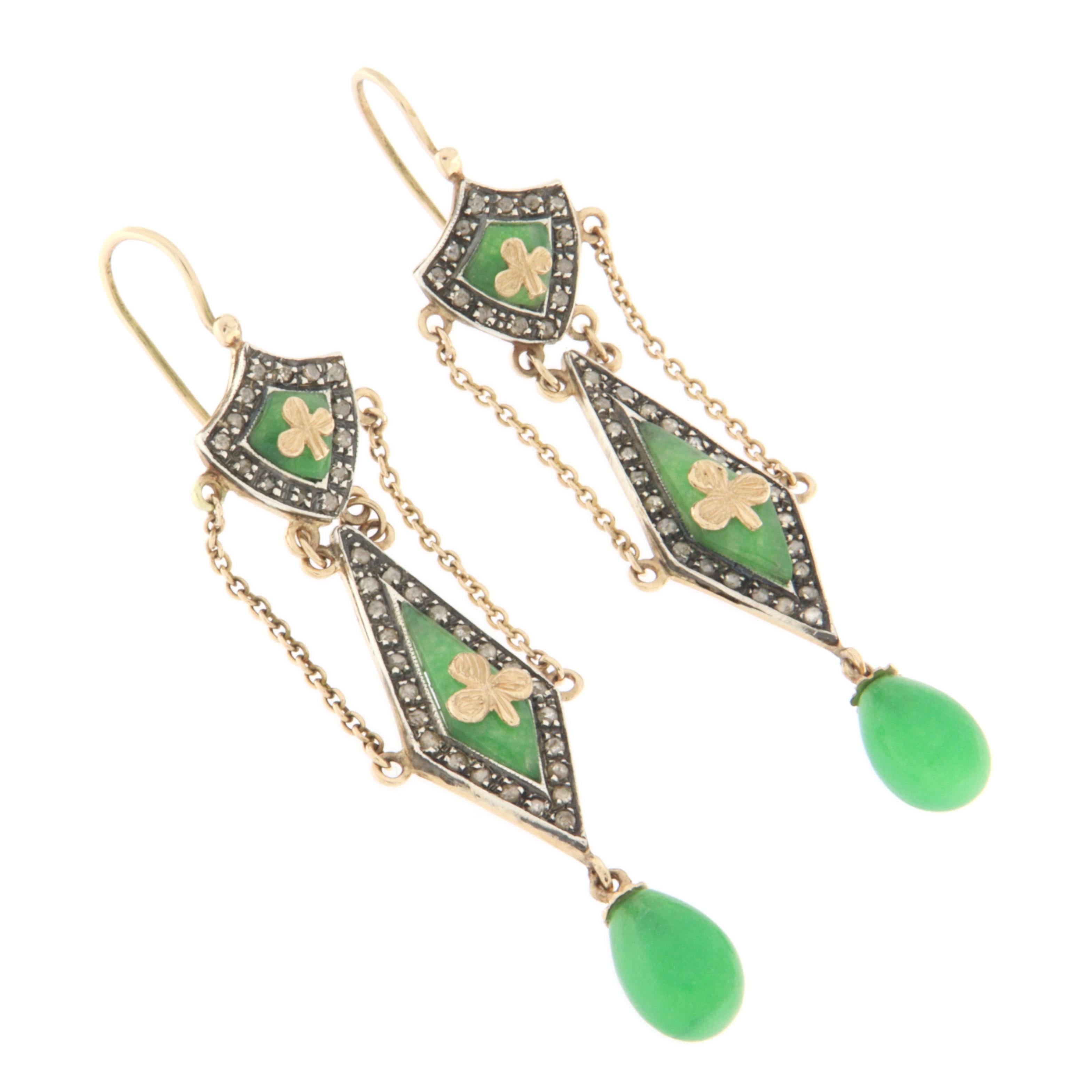 A stunning pair of vintage-style dangling earrings, expertly handcrafted in 14 karat yellow gold and 800 silver, enriched with fine materials and exquisite detailing. These earrings beautifully combine the nobility of precious metals with the