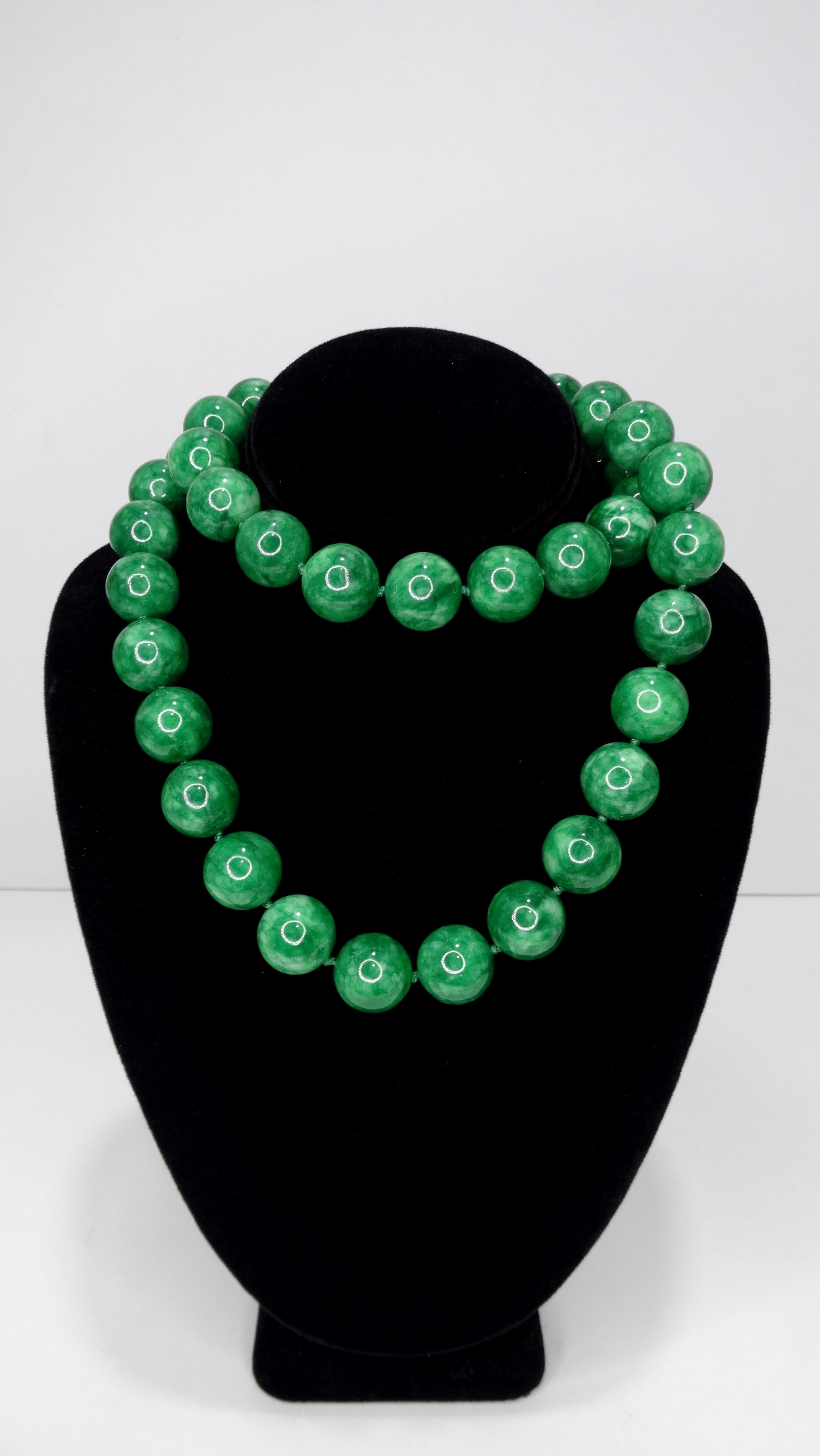 Jade bead necklace purchased in mid/late 20th century. Weighs 370.55g in total weight and has 45 beads, beads are Large in scale and knotted in between each bead 16 inches long. Perfect for layering with your favorite Gold Chains or Chanel