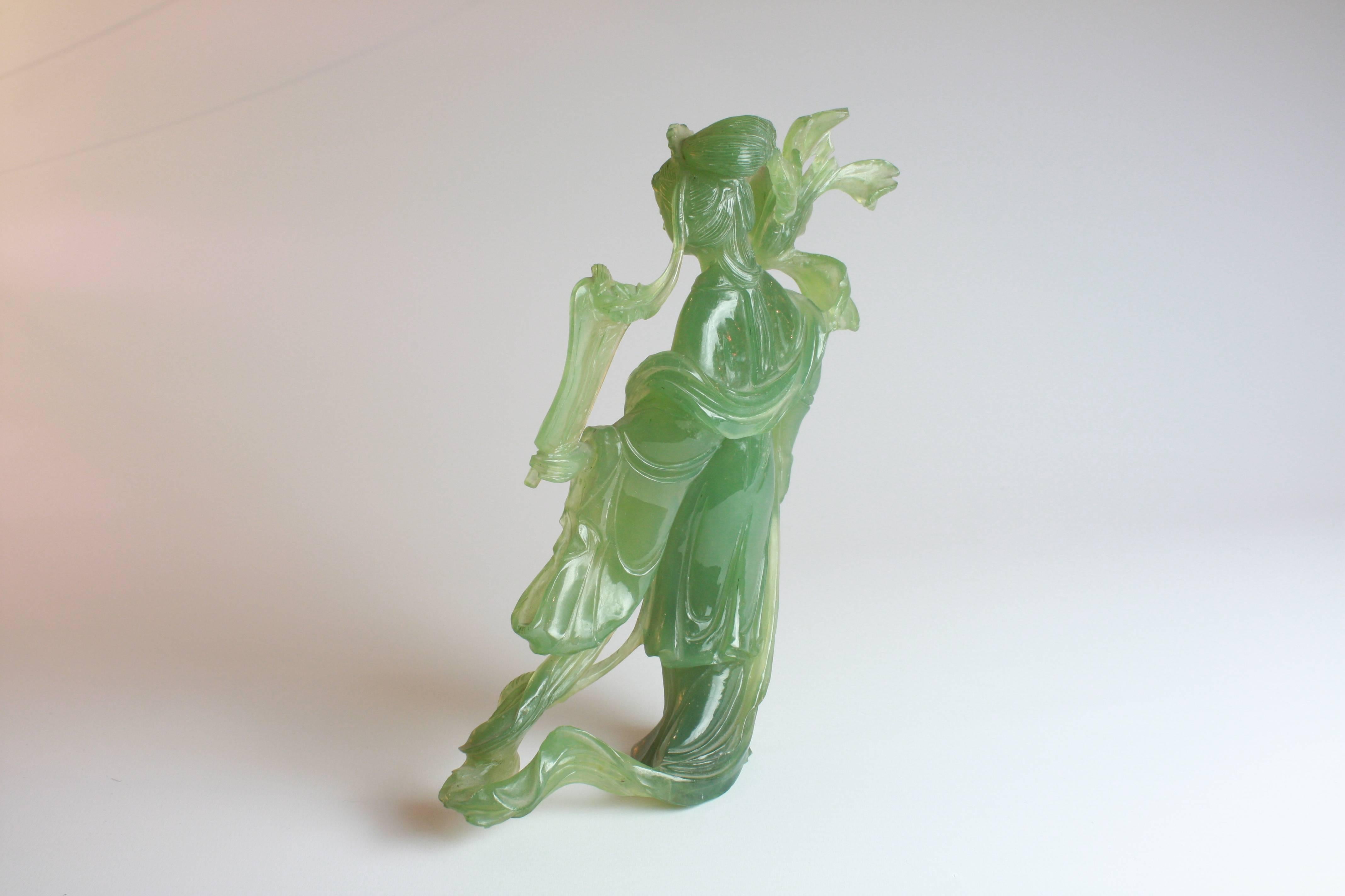 A good quality carved jade figure.
Early 20th century.

Measures: She stands 8 1/2