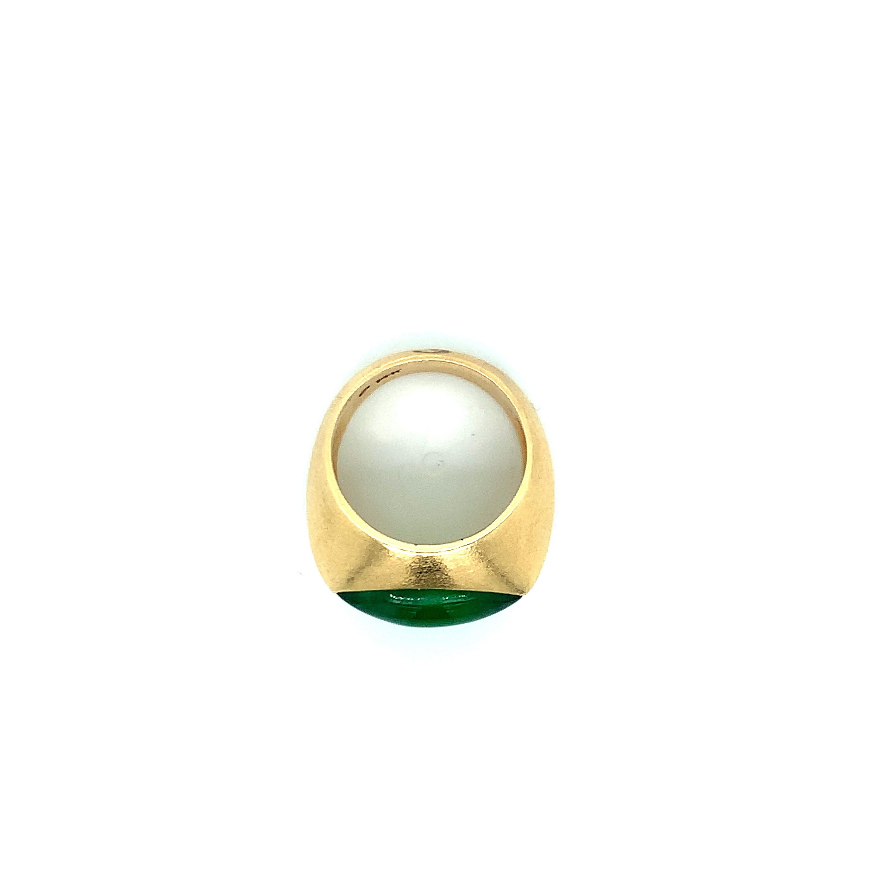 A 14 karat gold ring with a natural type A jade at its center. Total weight: 8.7 grams. Size 6.25.
