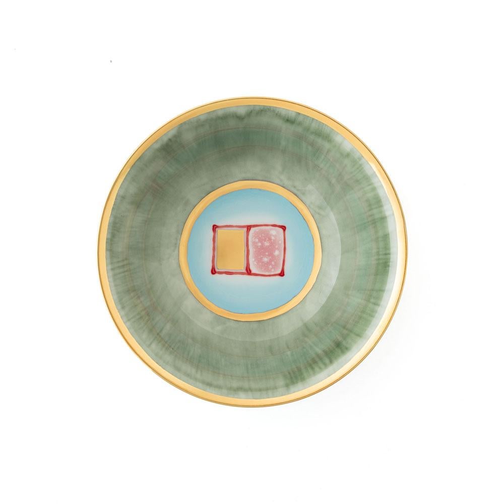 The Gold Impressions collection takes Coralla's exploration of geometry and minimalism to a new dimension, infusing her iconic designs with radiant gold accents. These golden elements transform familiar symbols, like the Mountain, into luminous
