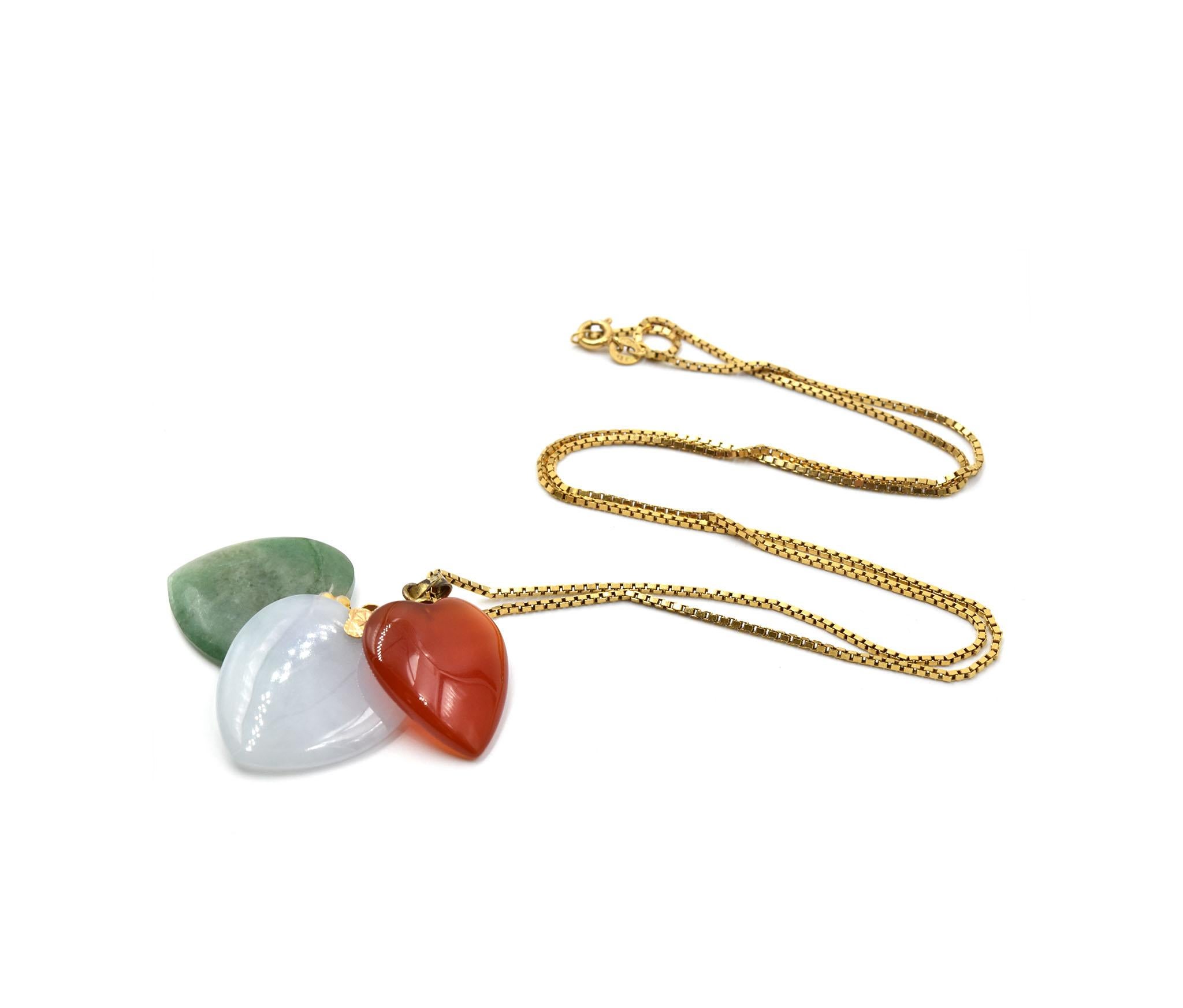 Designer: custom design
Material: 18k yellow gold
Jade: three smooth heart shape pieces of jade in red, green & white
Dimensions: necklace is 26-inch long
Weight: 20.25 grams
