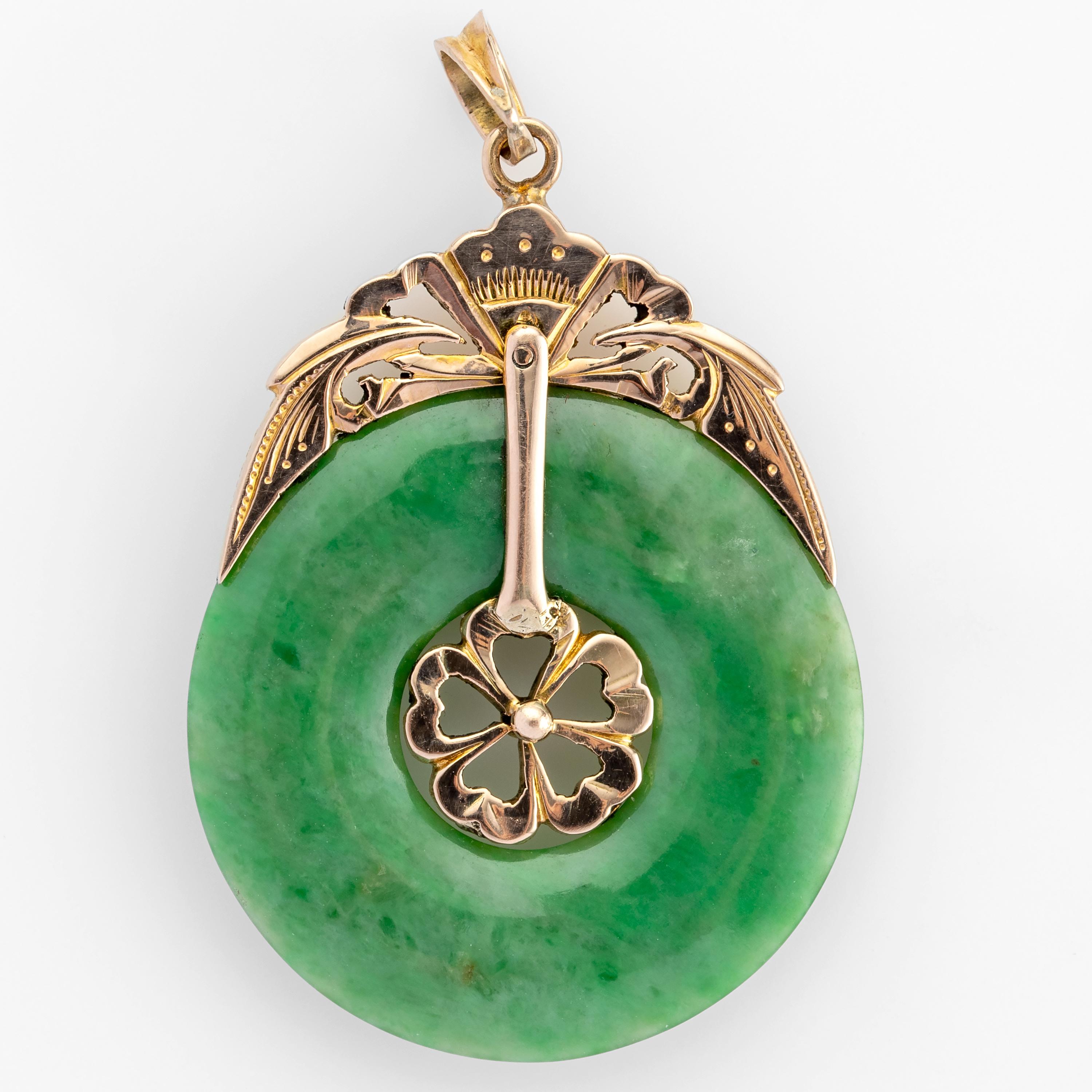 A certified natural and untreated Burmese jadeite jade hololith (a ring made from one piece of stone) is adorned with a handmade 18K rose gold bail that attaches to the jade through the clever design of five hearts in the central hole. The rest of