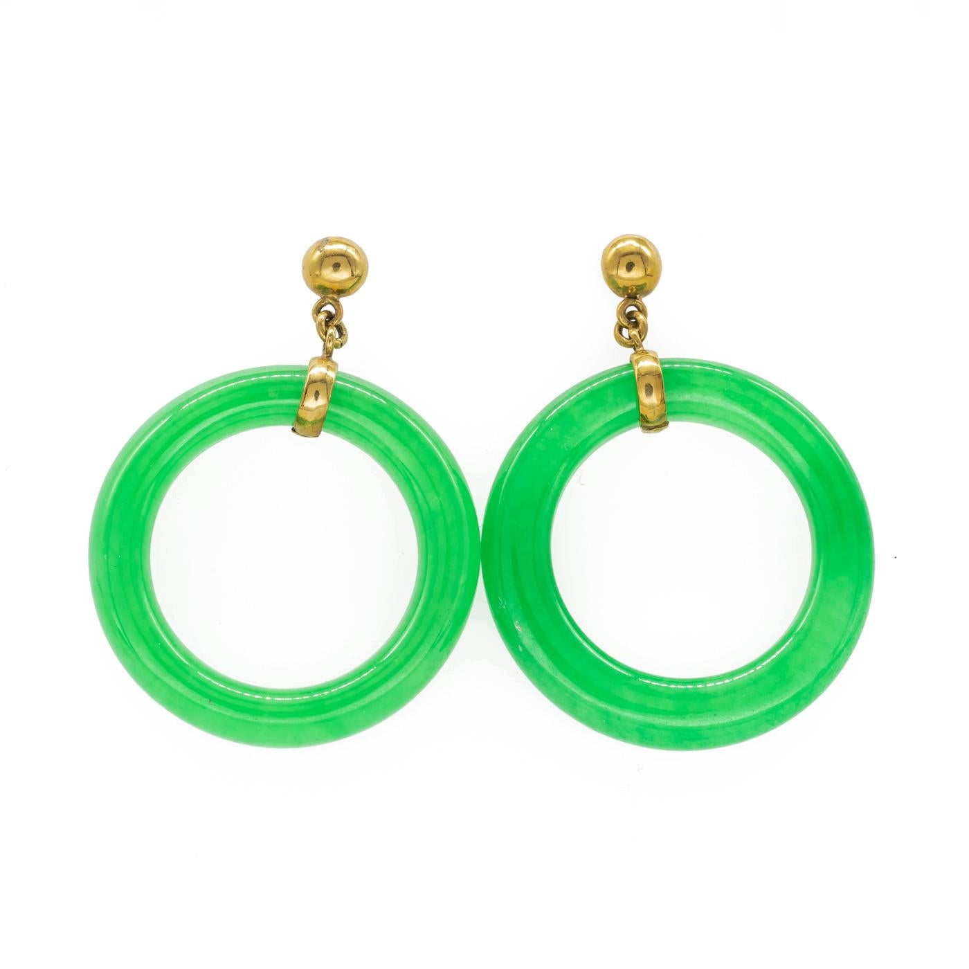 A pair of jade hoop earrings, 6mm wide jade hoop with a 15ct gold fitting suspended from a gold stud.
Inside diameter measures approximately 22mm