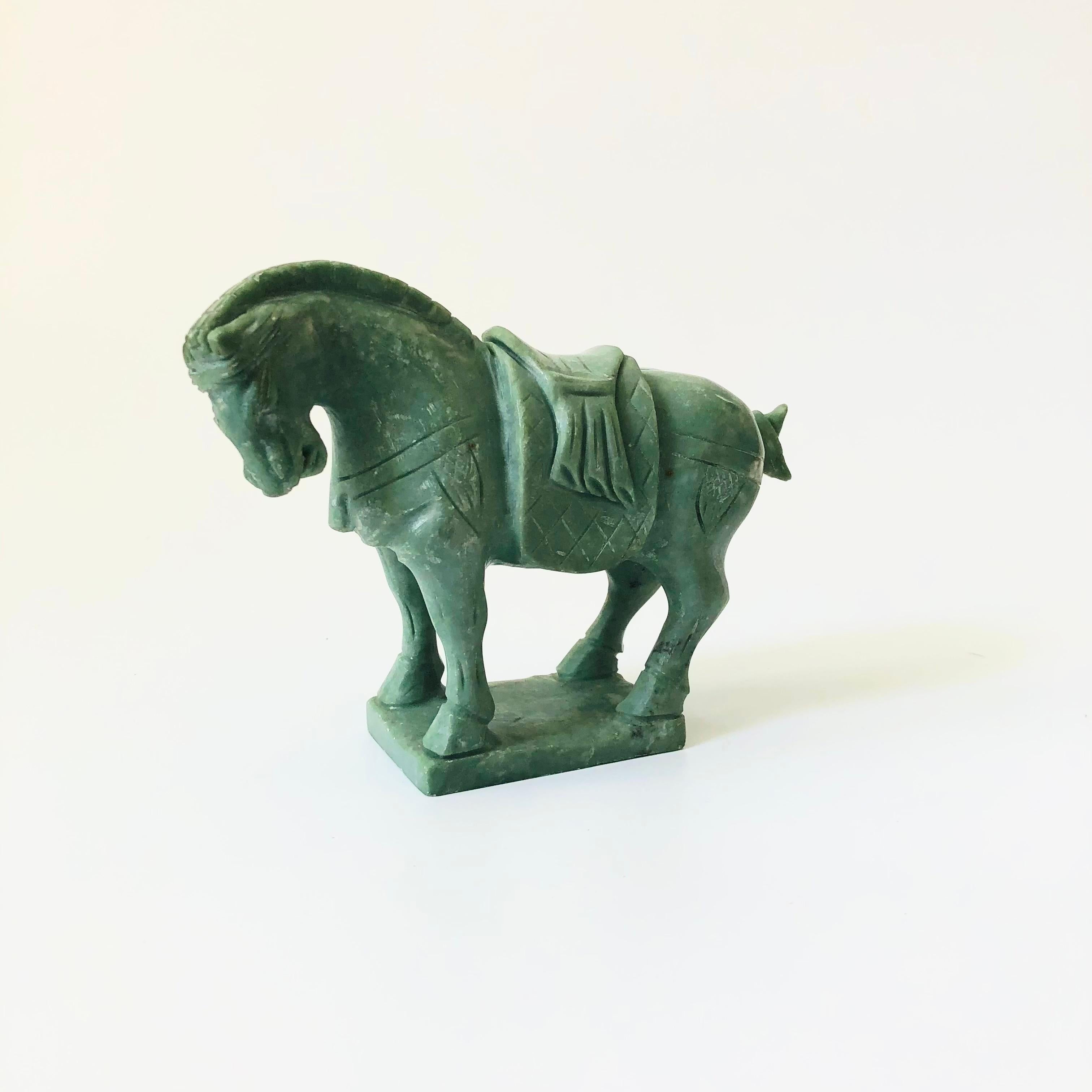 A vintage carved stone horse. Beautiful green color to the stone, believed to be jade.

