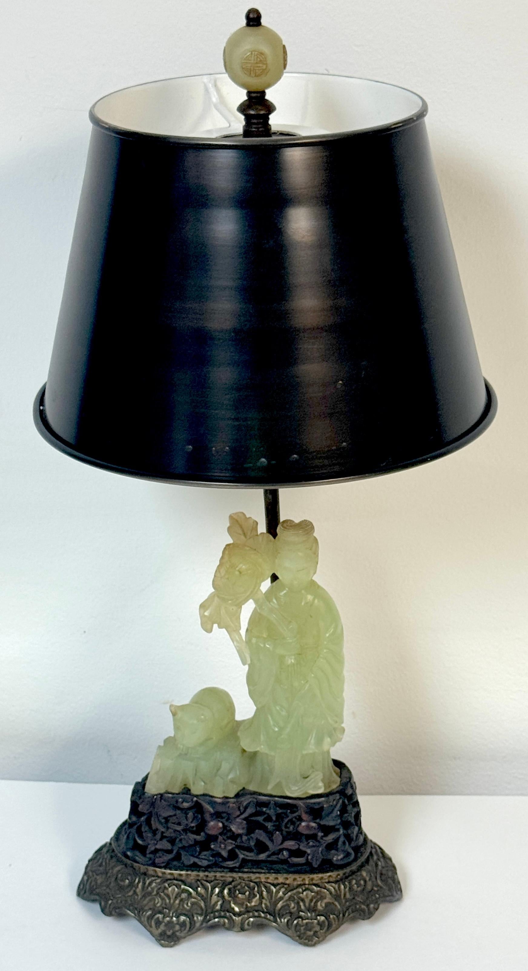 Chinese Carved Jadeite Guanyin with Cat, Mounted as a Lamp on French Bronze Base with Longevity Finial, Circa 1920, Two pieces of Jadeite, the Lamp (complete with complimentary  shade) and the Jadeite finial .

An elegant and culturally significant