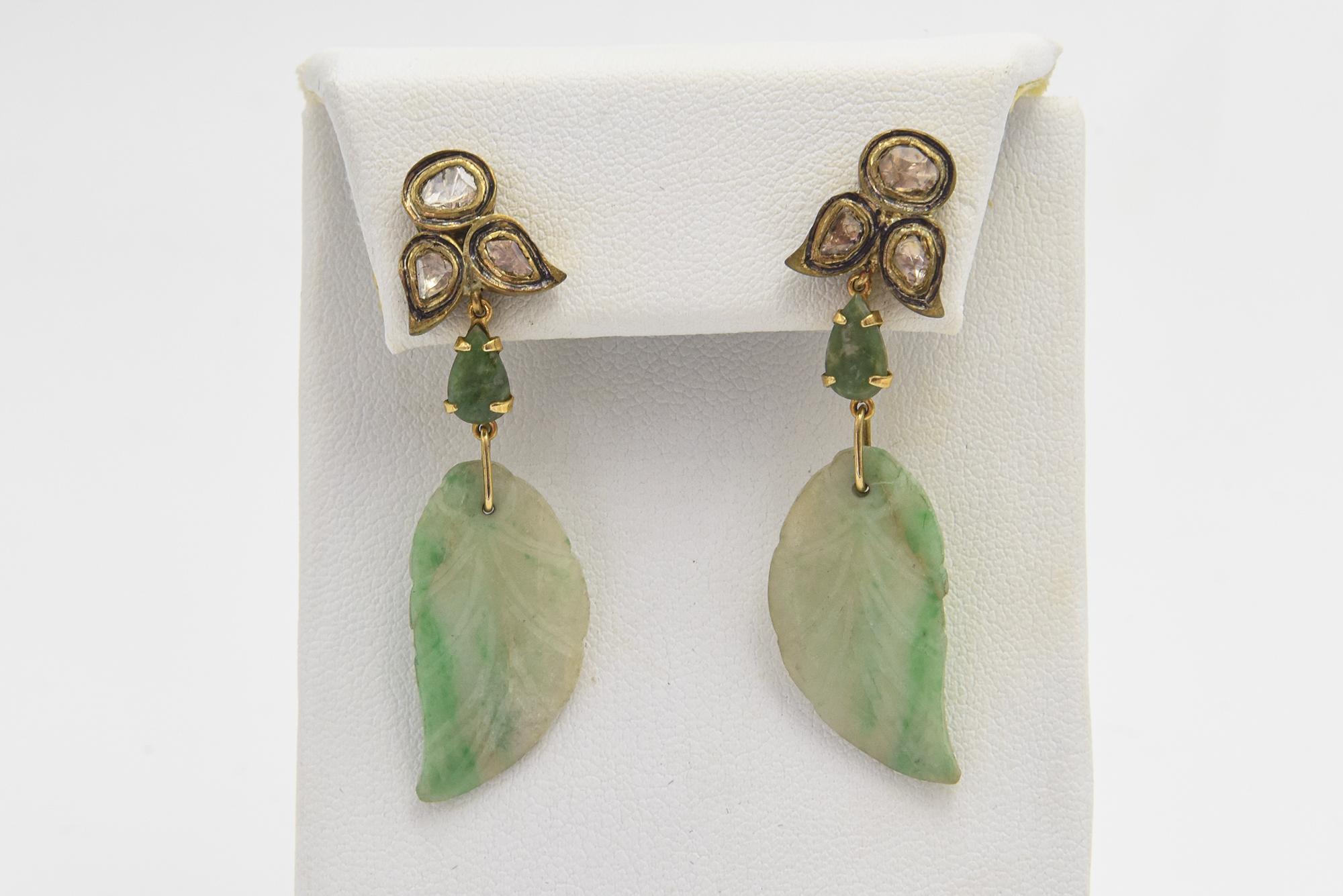 Carved Jade leaves hanging from a diamond leaf made from rose cut diamonds. The mounting is vermeil silver. Post backs so pierced ears are a must.
