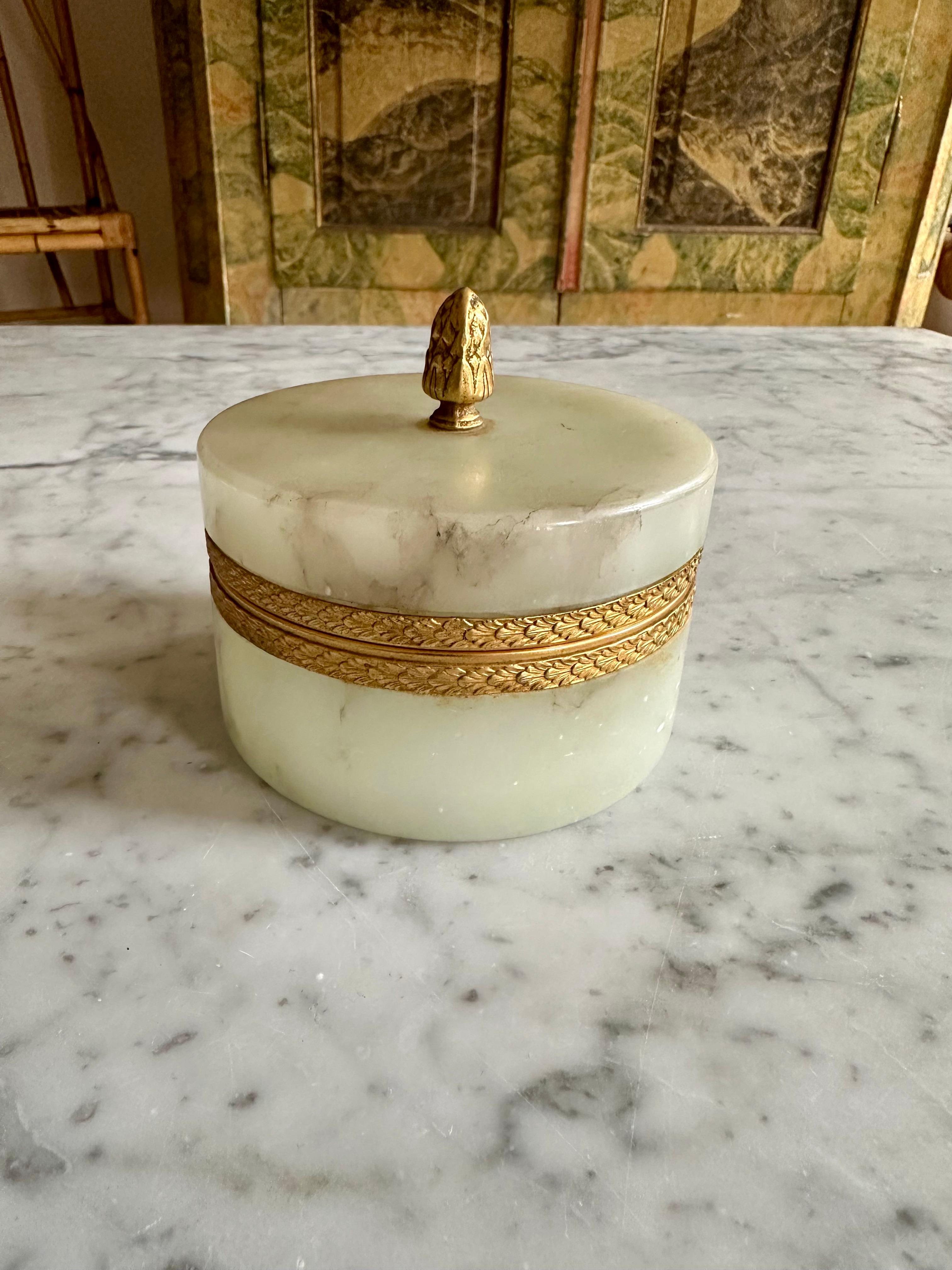 
Jade Marvel: Italian Mid Century Marble Lidded Jar with Gilded Accents
Uncover the splendor of mid-century design with our Italian-crafted lidded jar, showcasing the enchanting allure of jade-colored marble. Resembling an opaline treasure, this