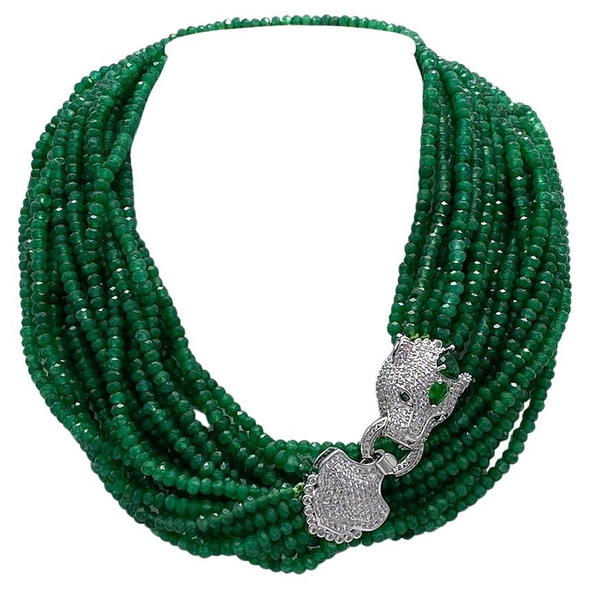 This is a jade multi-strand necklace with leopard clasp. It has a fancy CZ on silver leopard head fold over clasp that contrasts nicely with ten strands of silk knotted 4-5mm faceted green jade beads. Either double it up around your collar or let it
