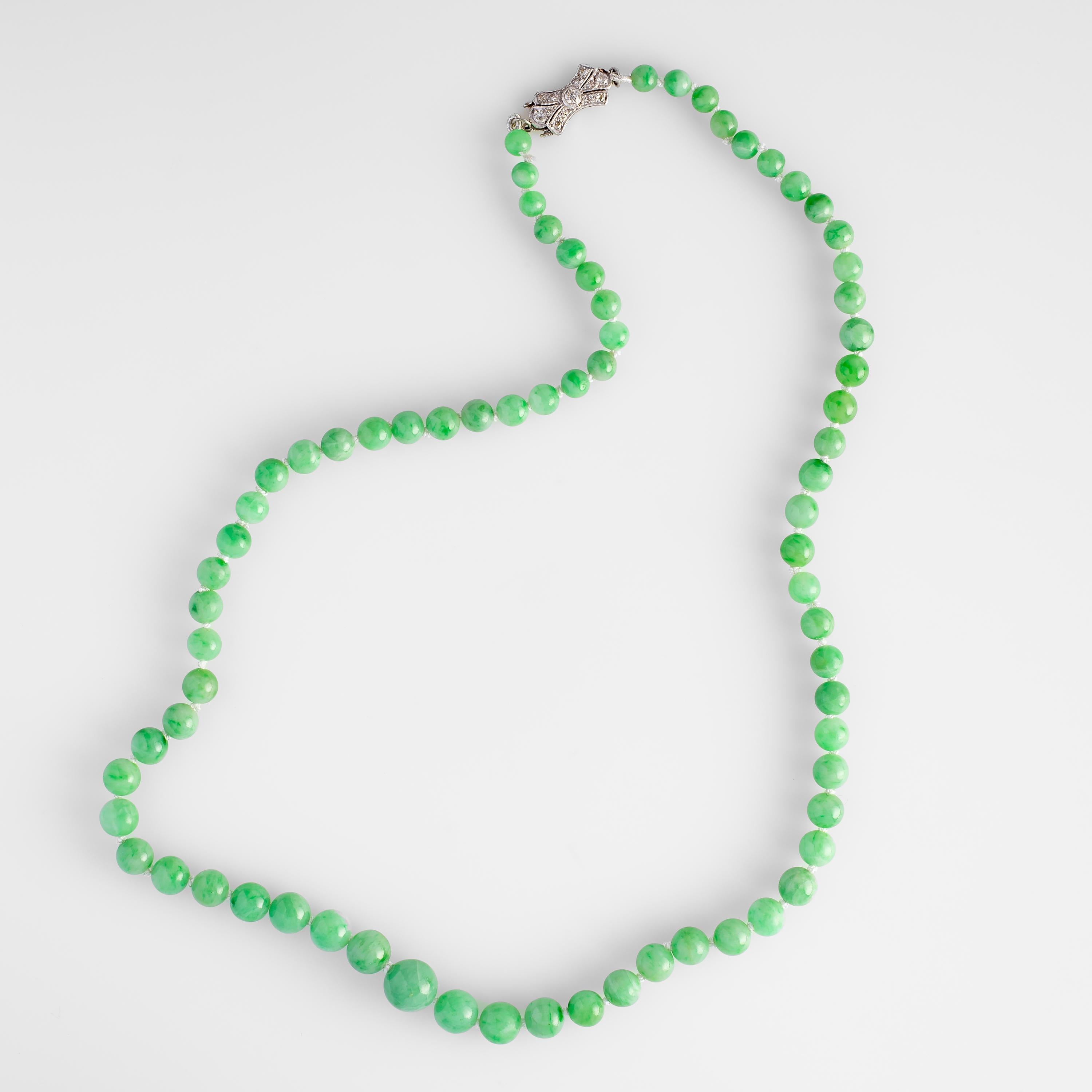 This lively necklace is composed of 73 light apple-green natural and untreated jadeite jade beads. The hand-carved and polished beads graduate in size from 5.11mm near the clasp to 10.01 at the center. This beautiful Art Deco treasure is finished