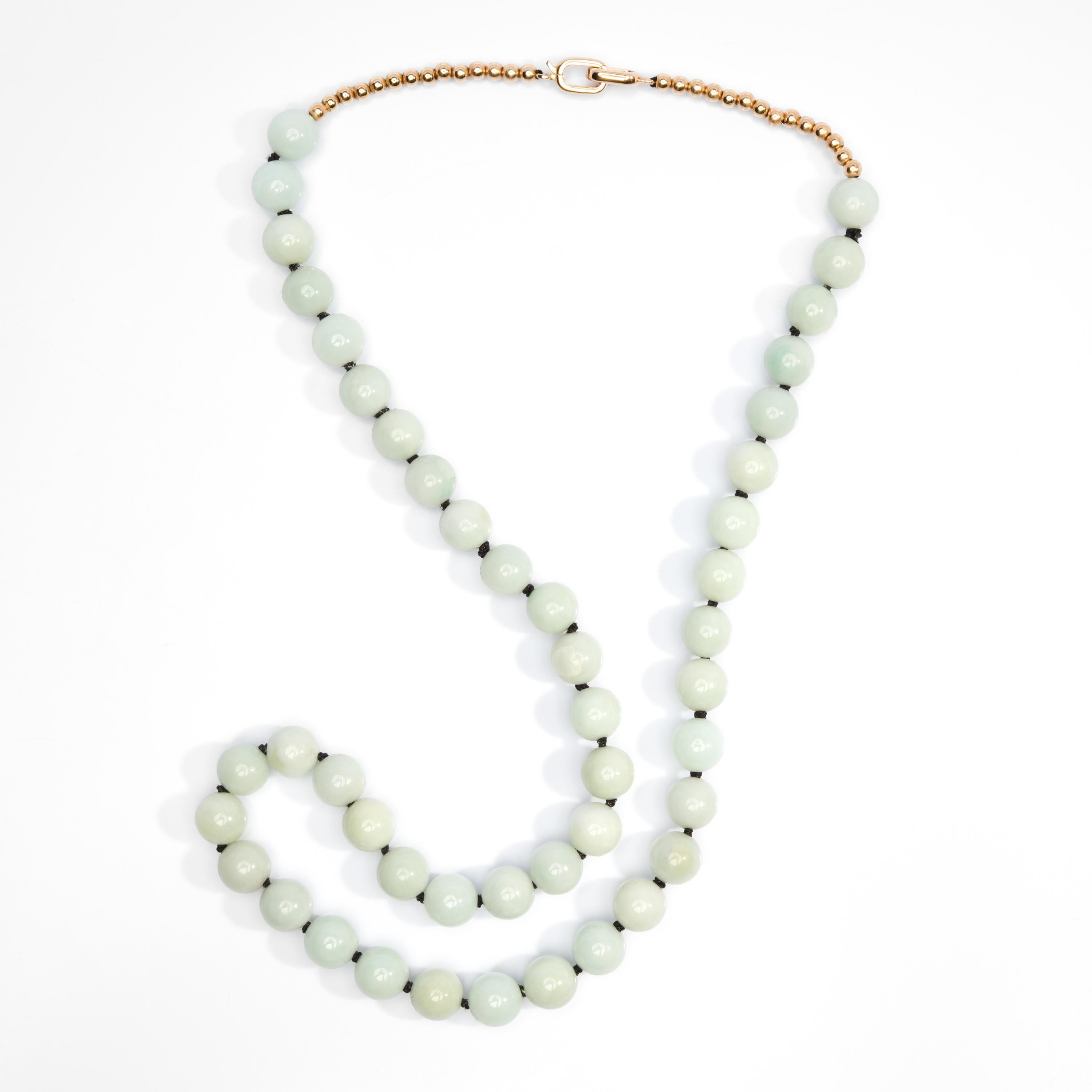 Composed of 46 natural, untreated opaque Burmese jadeite jade beads in a soft bluish-green, this beautiful and understated necklace serves as 