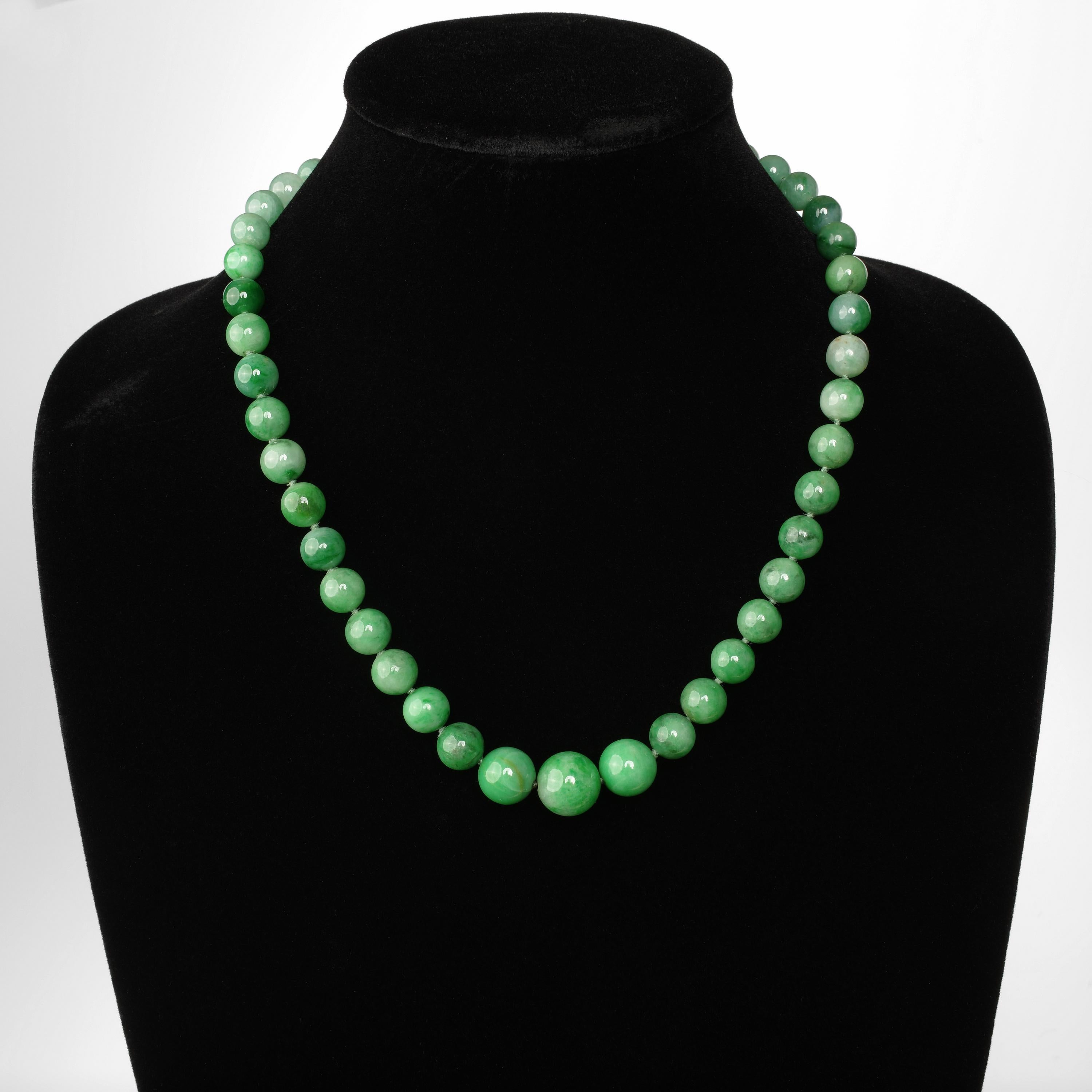 This exceptionally rare and important jade necklace is comprised of forty-seven hand-carved Mason Kay certified natural and untreated 