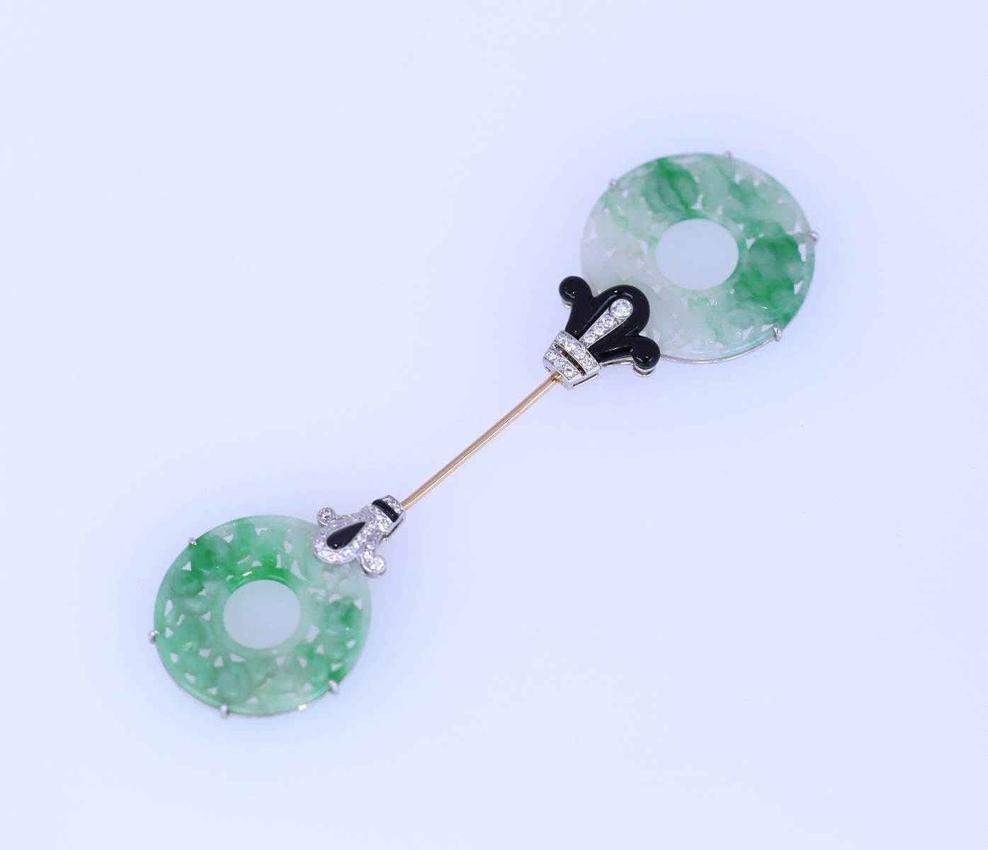 Jade Onyx Diamonds Brooch Pin Cellini NYC really delicate and fine work of jeweler. 
The brooch has a simple lock mechanism, the bigger part must be turned to a side to be released a simple and ingenious solution. 
Once the brooch is on the is put