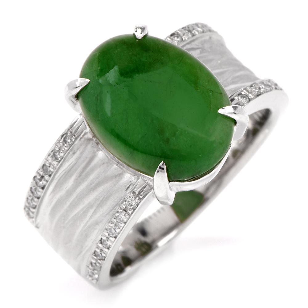 This sophisticated jade and diamond ring is crafted in solid platinum. Showcasing a centered prong-set GIA lab reported, natural, no treatments jade cabochon weighing approx. 5.51 carats. Featuring a textured platinum shank, embellished by two rows