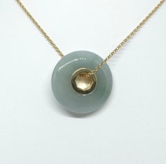 Jade Pendant set in 18 Karat Gold Settings
