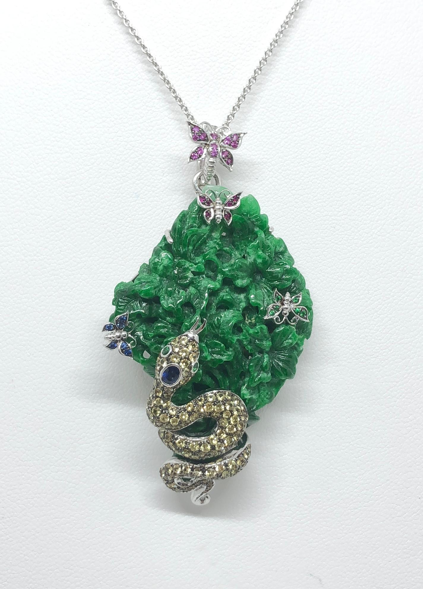 Jade 45.08 carats, Pink Sapphire 0.09 carat, Tsavorite 0.02 carat, Yellow Sapphire 1.29 carats and Blue Sapphire 0.21 carat Pendant/ Brooch set in 18 Karat White Gold Settings
(chain not included)

Width: 3.5 cm 
Length: 6.3 cm
Total Weight: 19.91