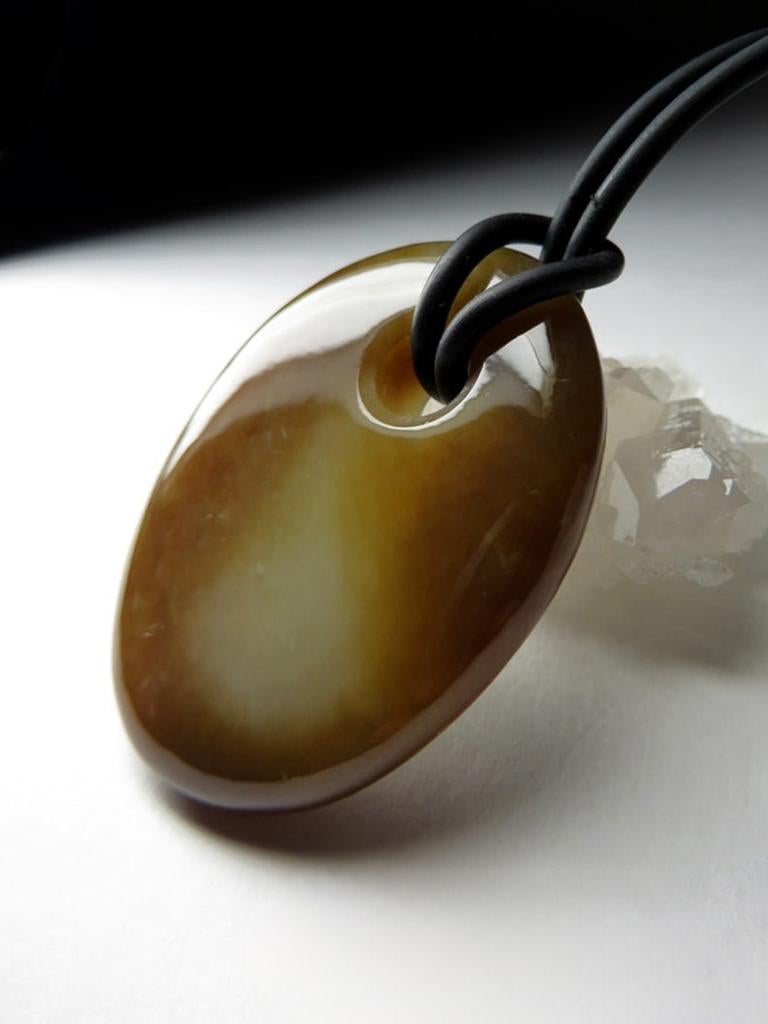Large pendant made from natural polychrome tobacco jade, a beautiful and unique variety of jade. Here's a summary of the details:

    Gemstone Type: Natural Polychrome Tobacco Jade
    Gem Dimensions: 0.31 x 1.14 x 1.5 inches / 8 x 29 x 38 mm
   