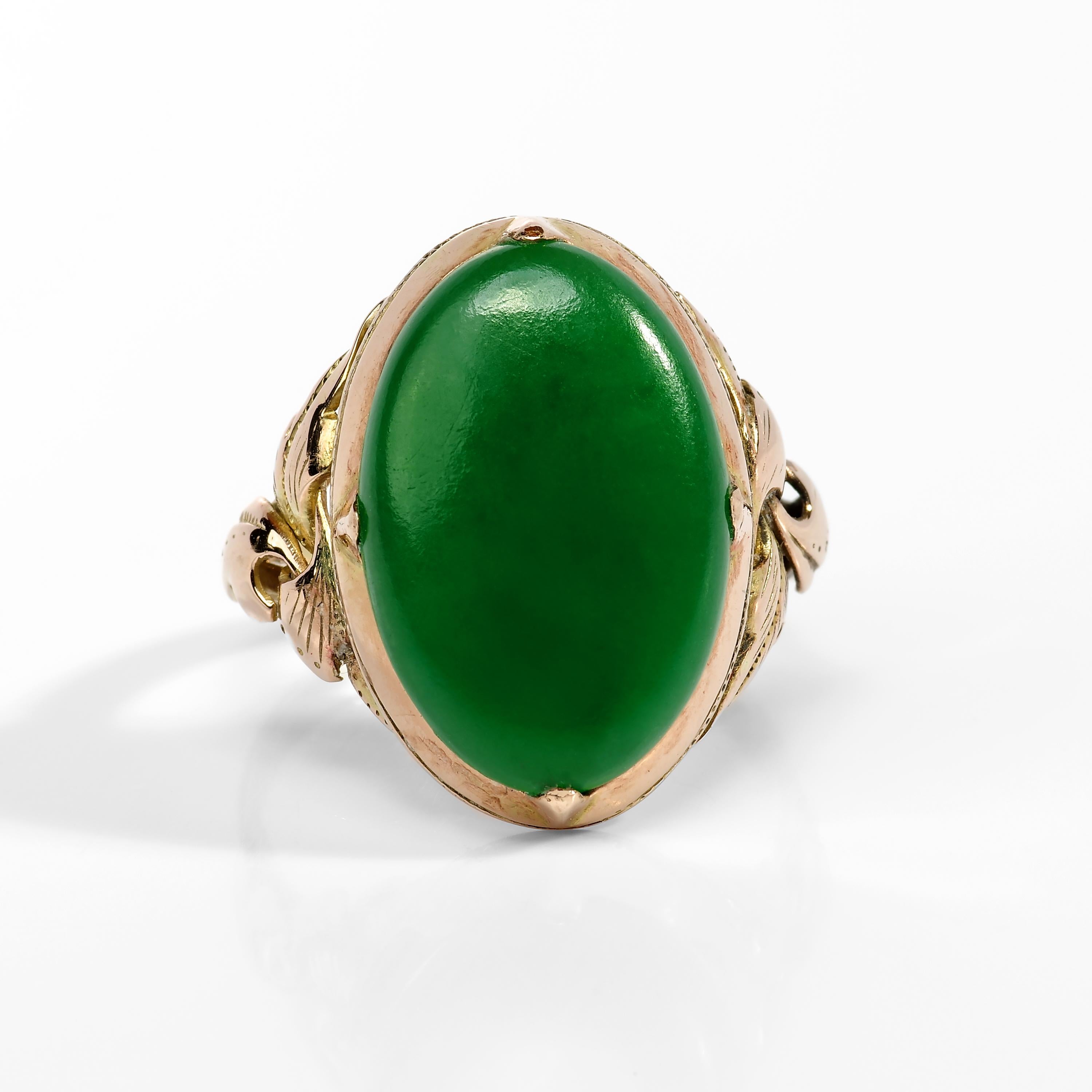The lush emerald-green jade cabochon set into this hand-fabricated 18K yellow gold mounting is so evenly toned, so vibrant, and so fine that when I first saw the ring I instantly dismissed it as an imposter. 