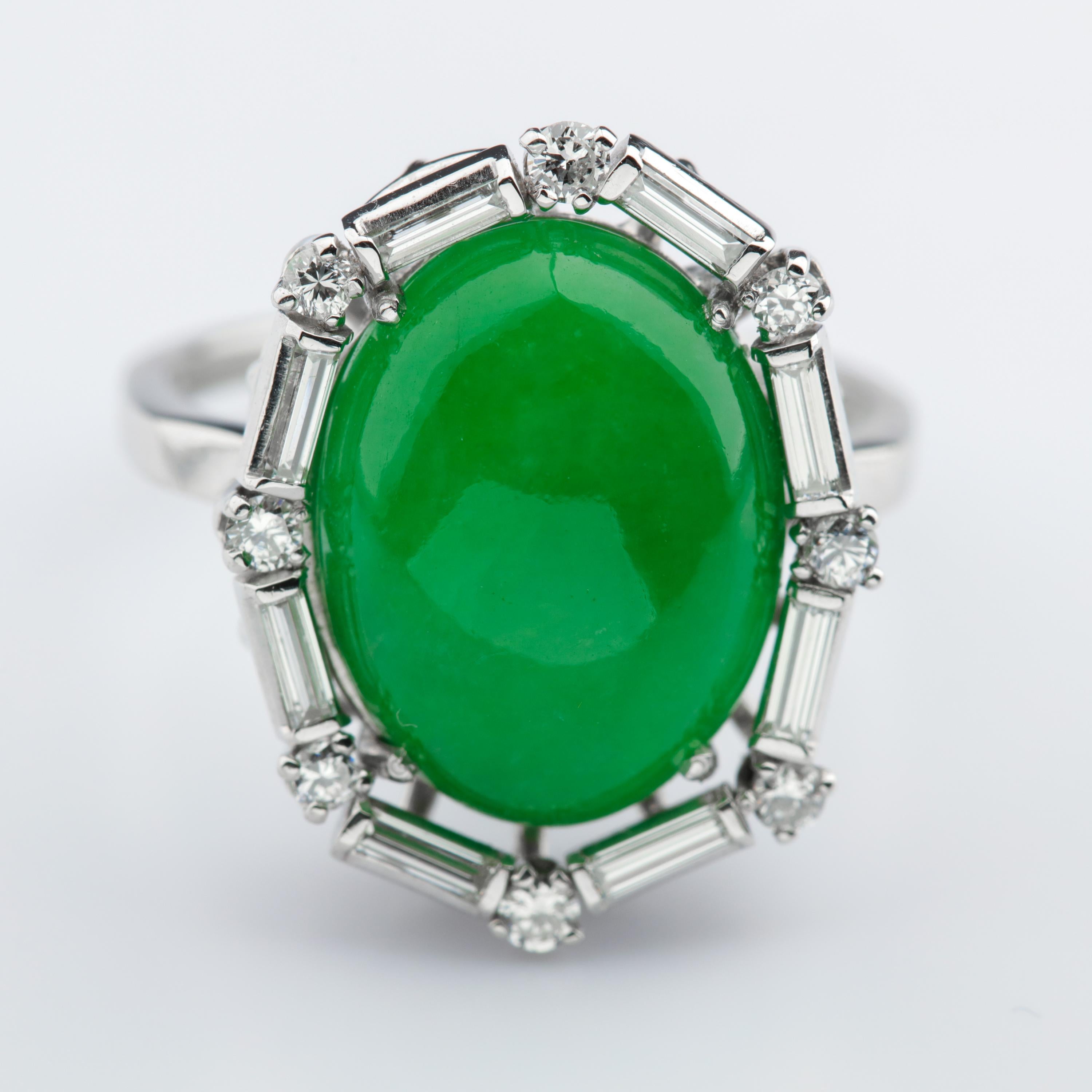 This magnificent and original Art Deco ring was hand-fabricated in platinum in the 1920s, most likely in America. It showcases a vivid, translucent and even-toned Mason Kay-certified natural and untreated jadeite jade double cabochon of