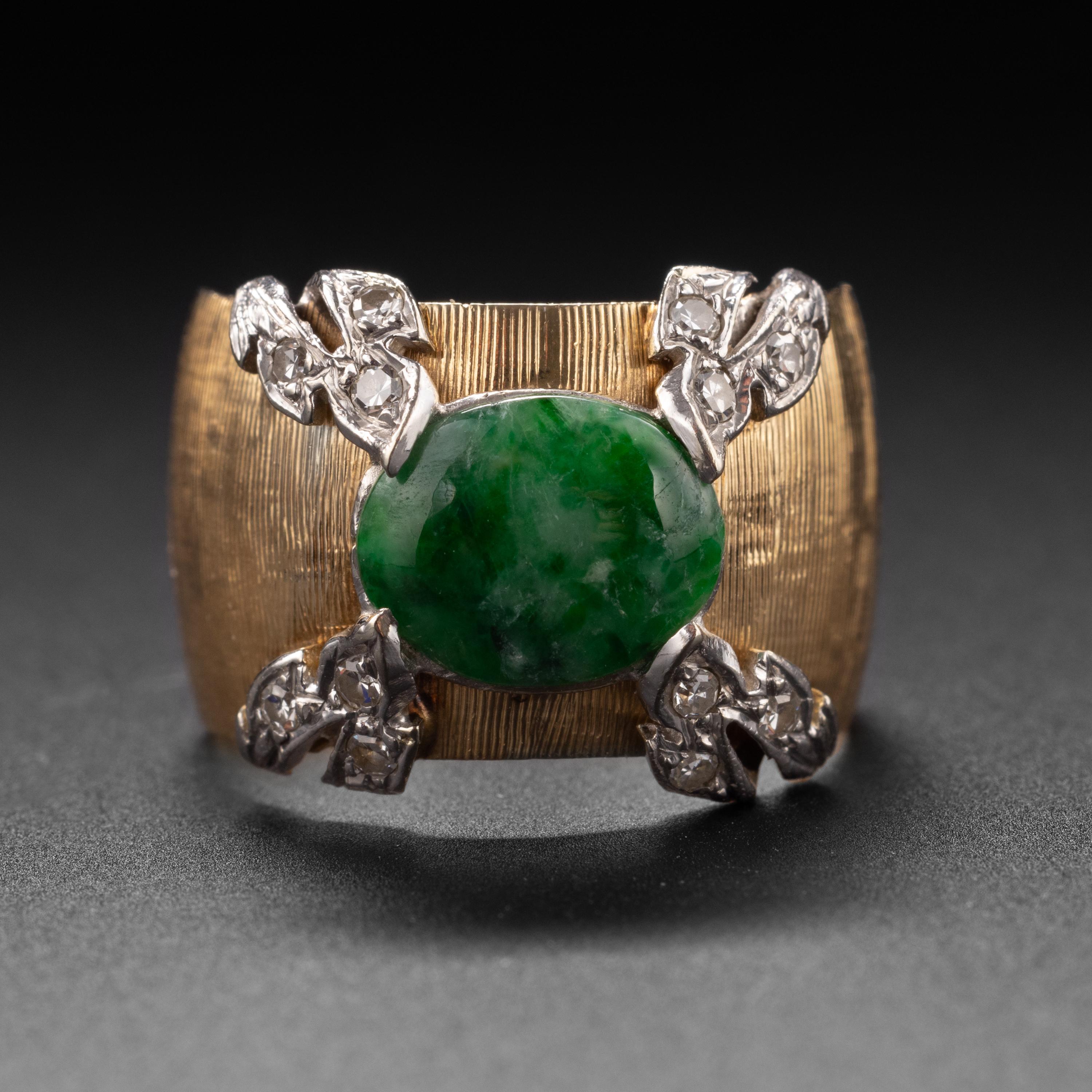 This 1950s-era band ring has been crafted by a master goldsmith. As with a fine Buccelatti jewel, every millimeter has been worked: from the freehand Florentine Finish to the gorgeously rendered four leaves -each set with 3 small white diamonds— and