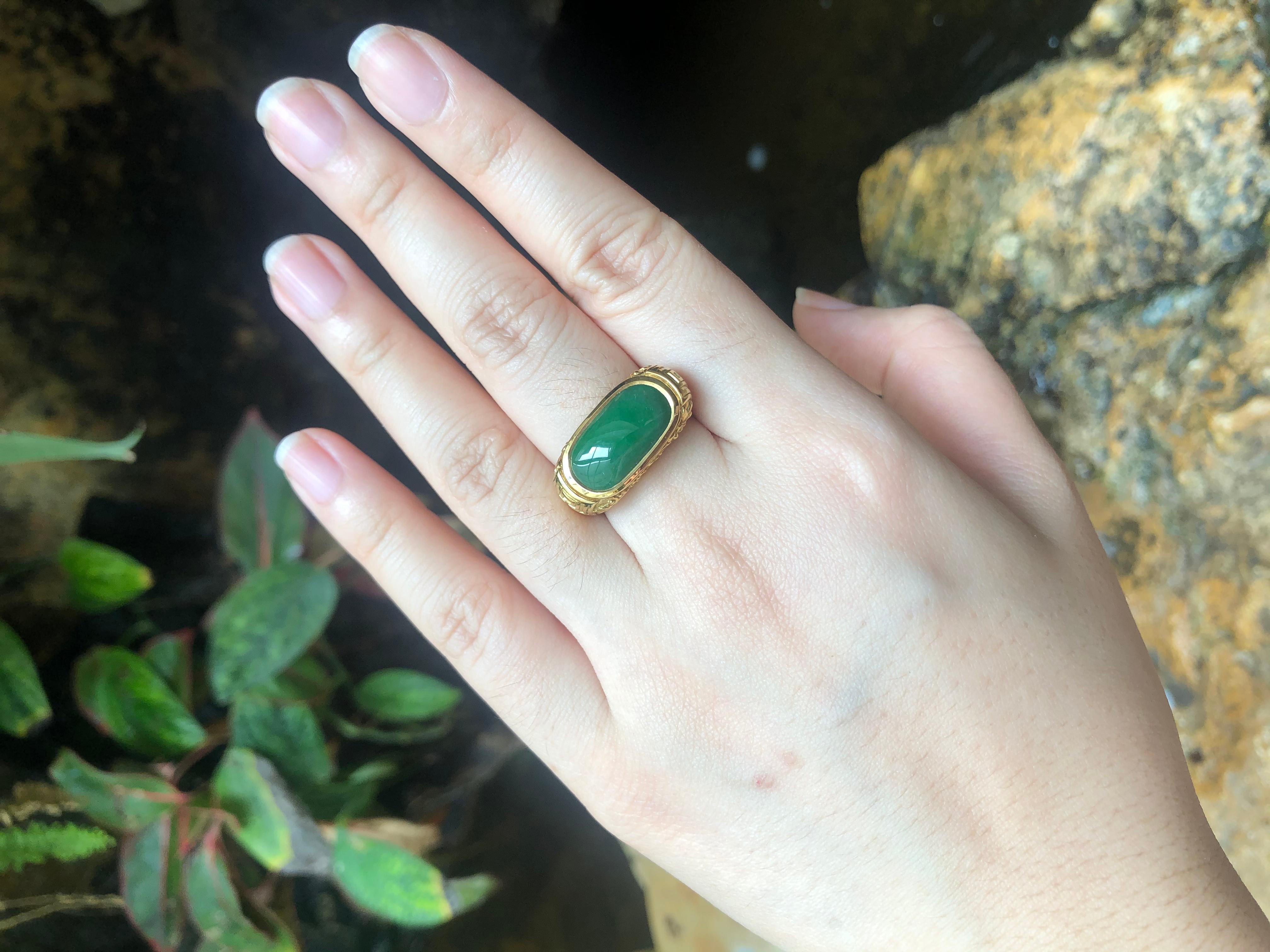 Jade 5.16 carats Ring set in 18 Karat Gold Settings

Width:  2.2 cm 
Length: 1.1 cm
Ring Size: 59
Total Weight: 17.5 grams

