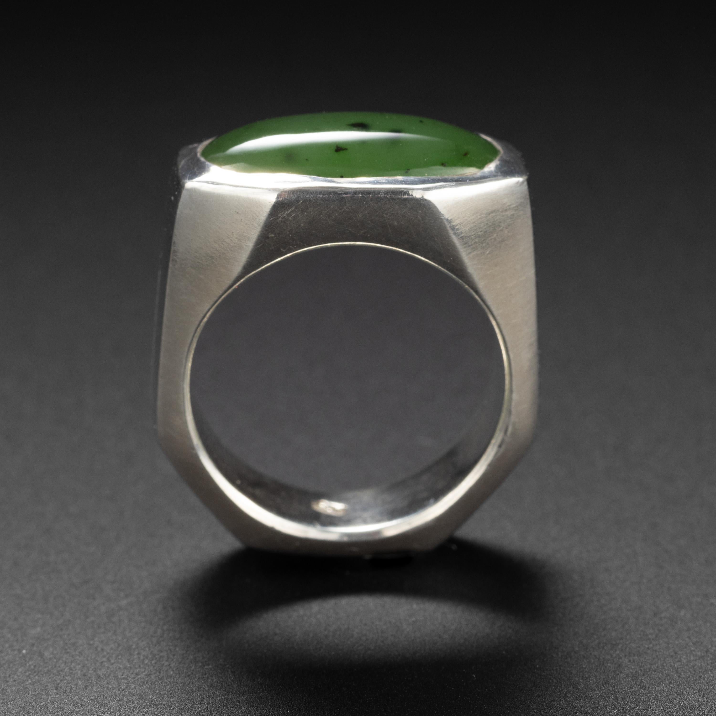 This artist-created solid sterling silver ring is just beautifully made. It's a joy to wear, so comfortable. And it features the most luminous, gleaming 18 x 9.9mm cabochon of untreated nephrite jade. The nephrite is almost certainly British