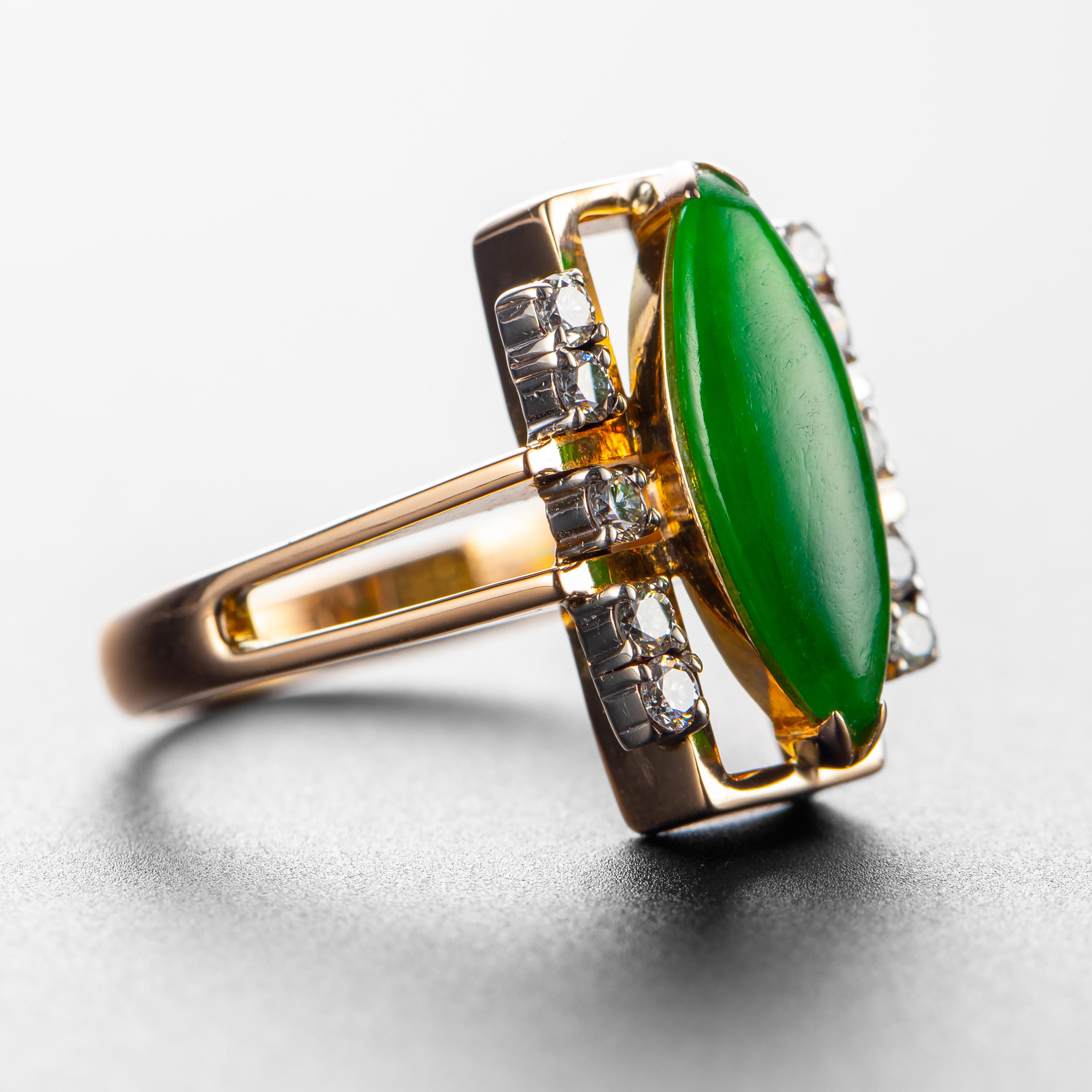 A magnificent fine green jadeite jade navette-shaped cabochon that is certified by Stone Group Labs to be natural and untreated jadeite from Burma creates a dramatic, vivid impact within this architectural retro rose gold setting. Five bright white