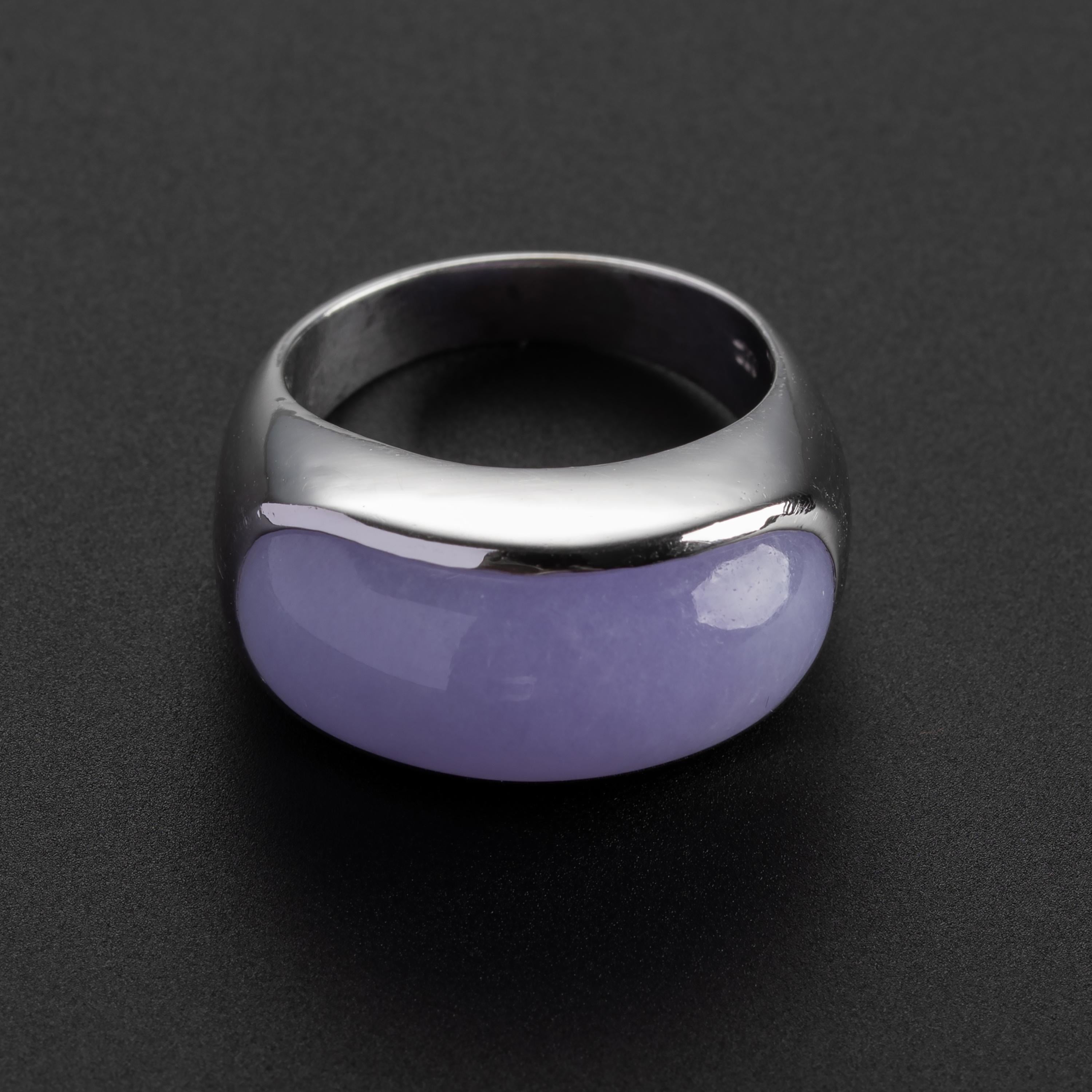 Rendered in gleaming white 18K gold and featuring a large (22.5mm x 9.3mm x 5.8mm) cabochon of bright, natural and untreated lavender jade, this unisex saddle ring is a perfect classic. The jade is magnificent and rare: highly translucent with a