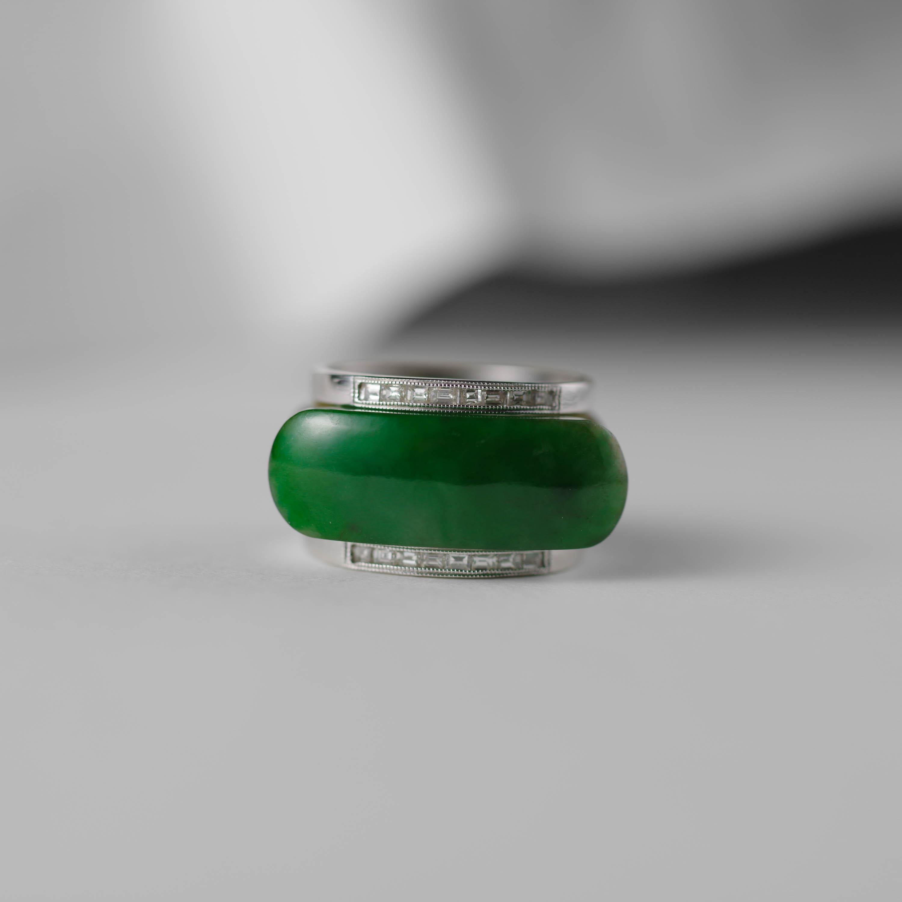 Hand-carved from a translucent stone of natural and untreated Burmese jadeite jade, this rather astonishing ring is among the most unique and extraordinary jade rings in my collection.

Jadeite with a humble body color of mottled greenish-brown has