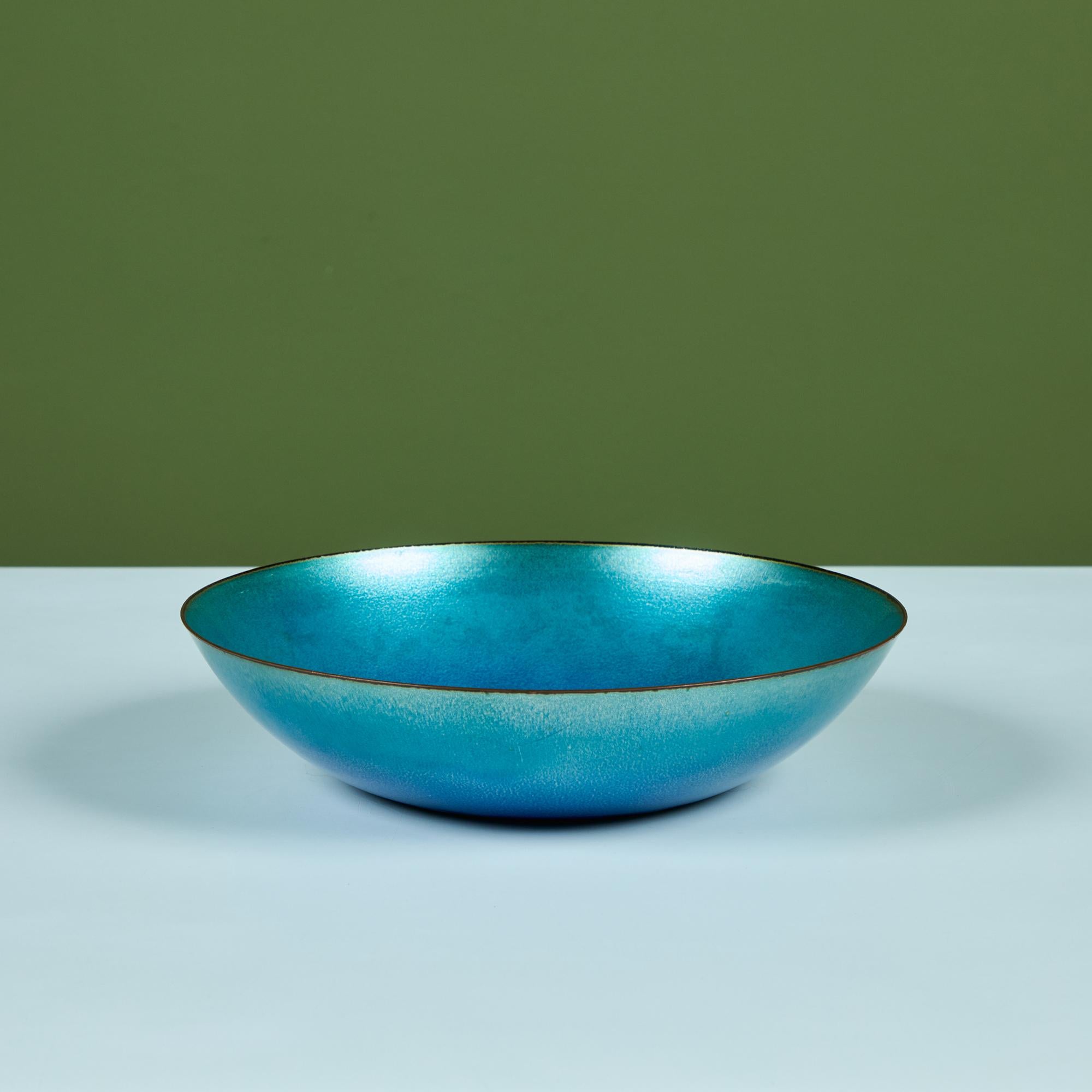 Copper enameled bowl by California artist, Jade Snow Wong c.1950s. The bowl features a copper form with a blue enamel glaze. Signed on the underside.

Dimensions
10.25