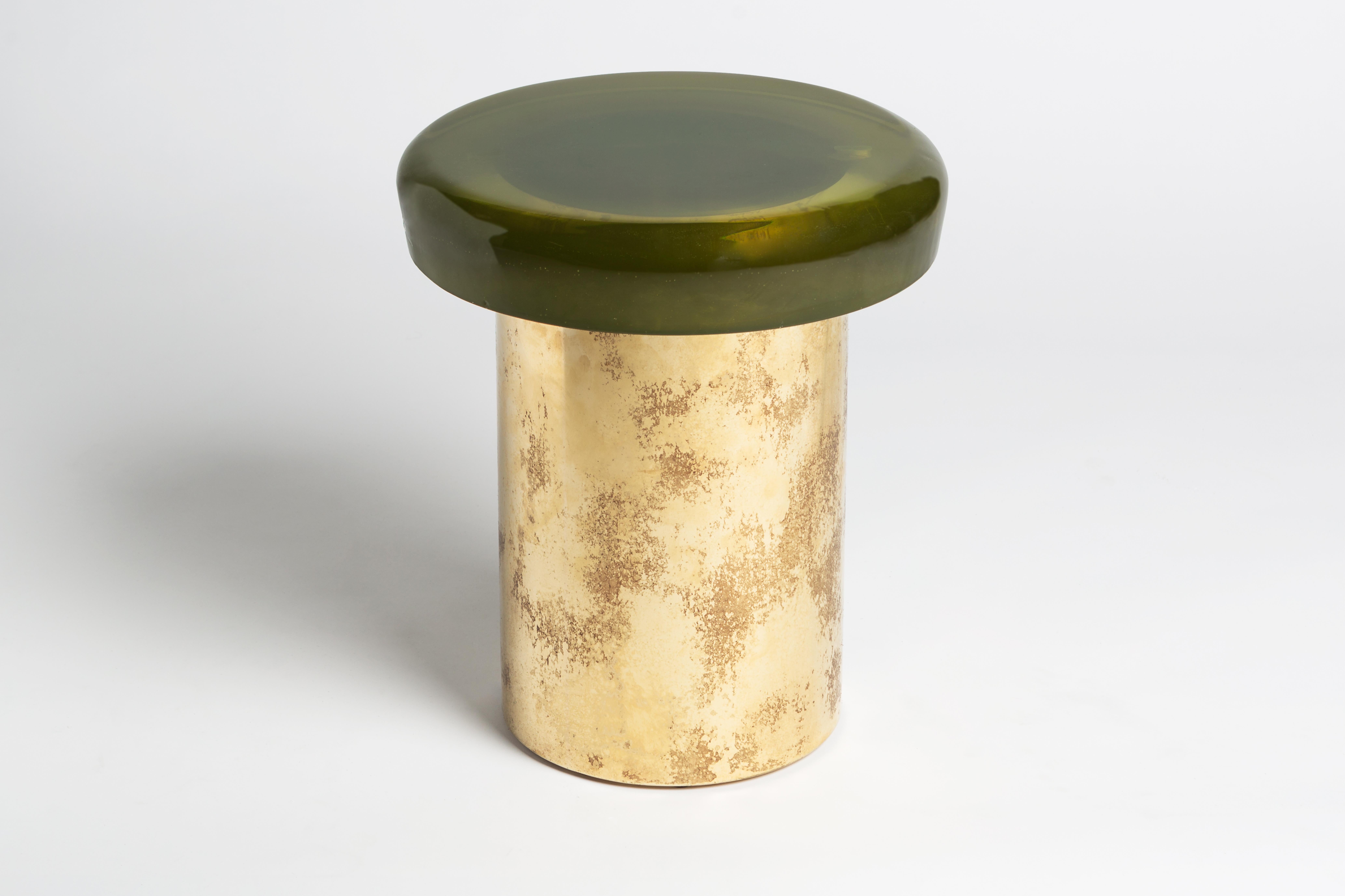 Jade stool by Draga & Aurel
Dimensions: W 40, D 40, H 46, top Ø 40 cm
Materials: Resin and bronze

Formed from a combination of reflective resin and solid brass, the Jade coffee tables look like precious gems. The surface is made by hand in