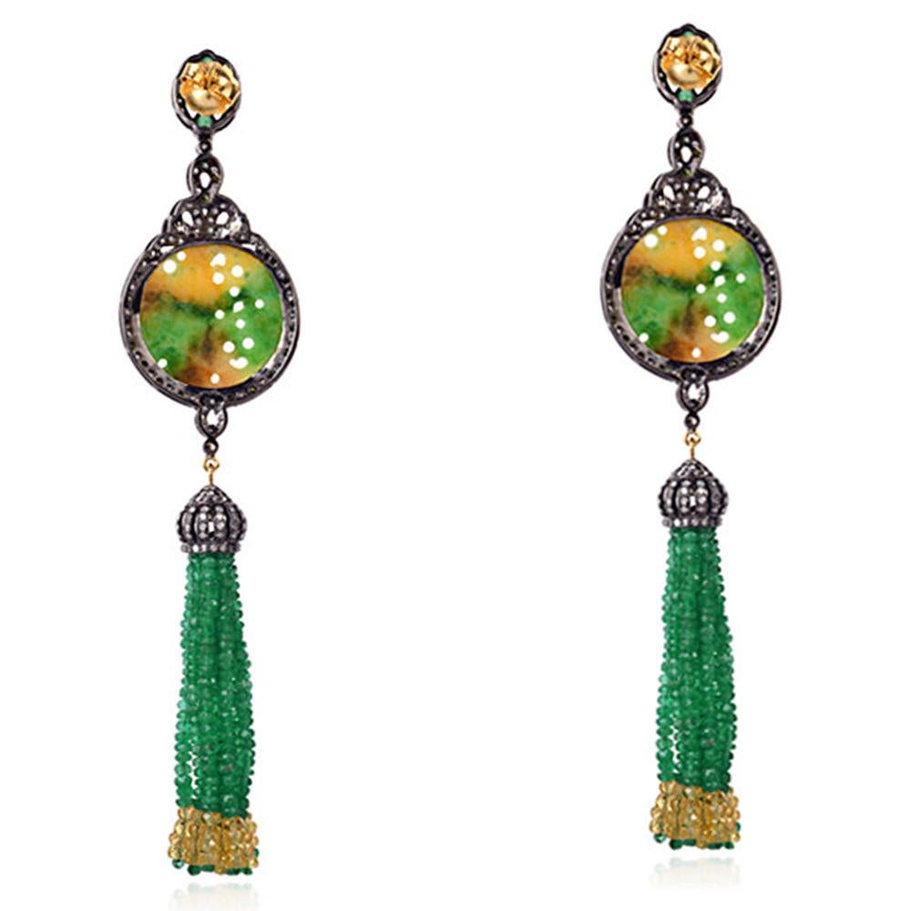 Long and evergreen these shaded green and yellow jade tassel earring with multi color sapphire and emeralds is a keeper.

Closure: Push Post

18Kt: 2.16gms
Diamond: 4.32Cts
Silver:1 2.64gms
EMERALD:37.66Cts 
JADE:23.85Cts
MULTI SAPPHIRE: 16.72Cts
