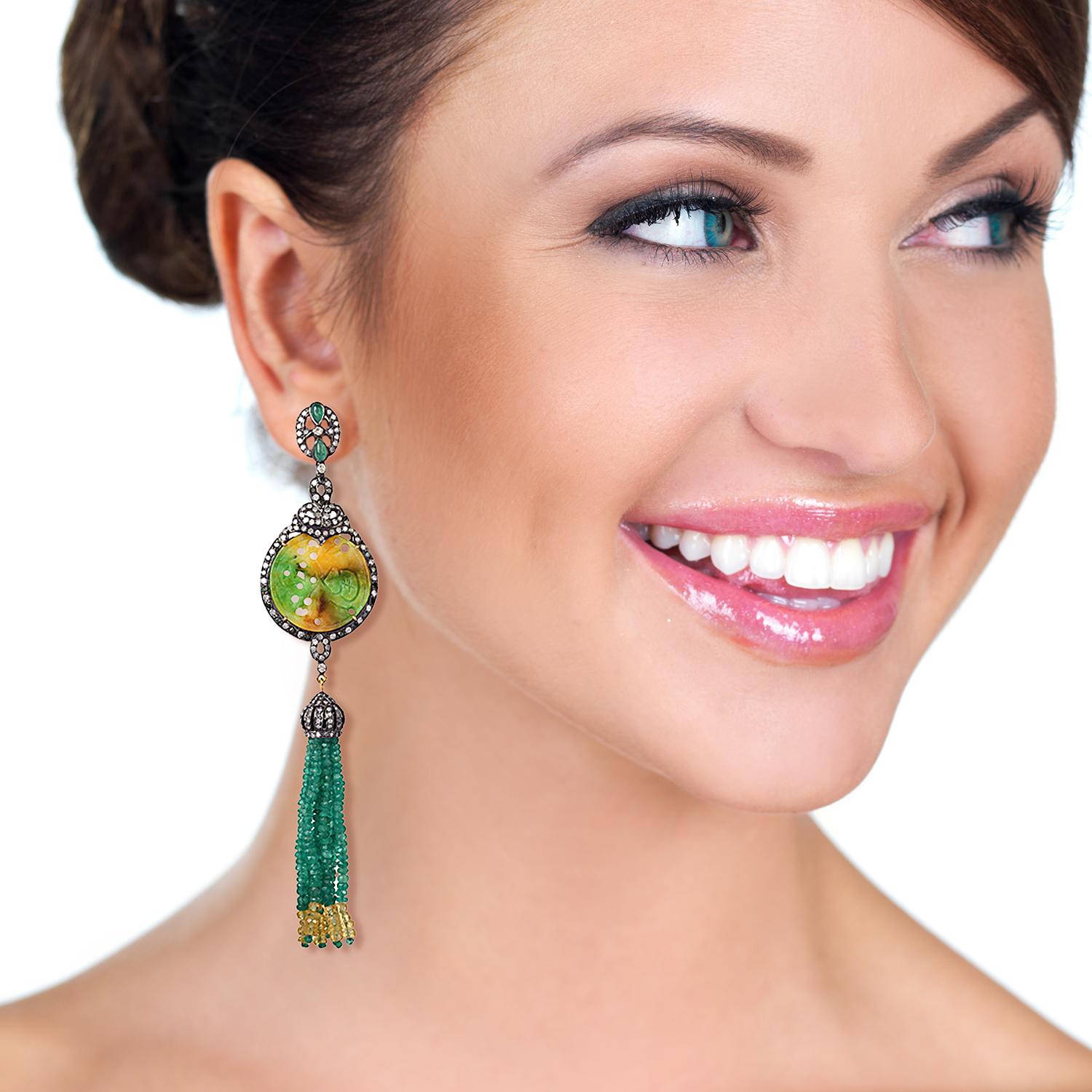 Long and evergreen these shaded green and yellow jade tassel earring with multi color sapphire and emeralds is a keeper.

Closure: Push Post

18Kt: 2.16gms
Diamond: 4.32Cts
Silver:1 2.64gms
EMERALD:37.66Cts 
JADE:23.85Cts
MULTI SAPPHIRE: 16.72Cts
