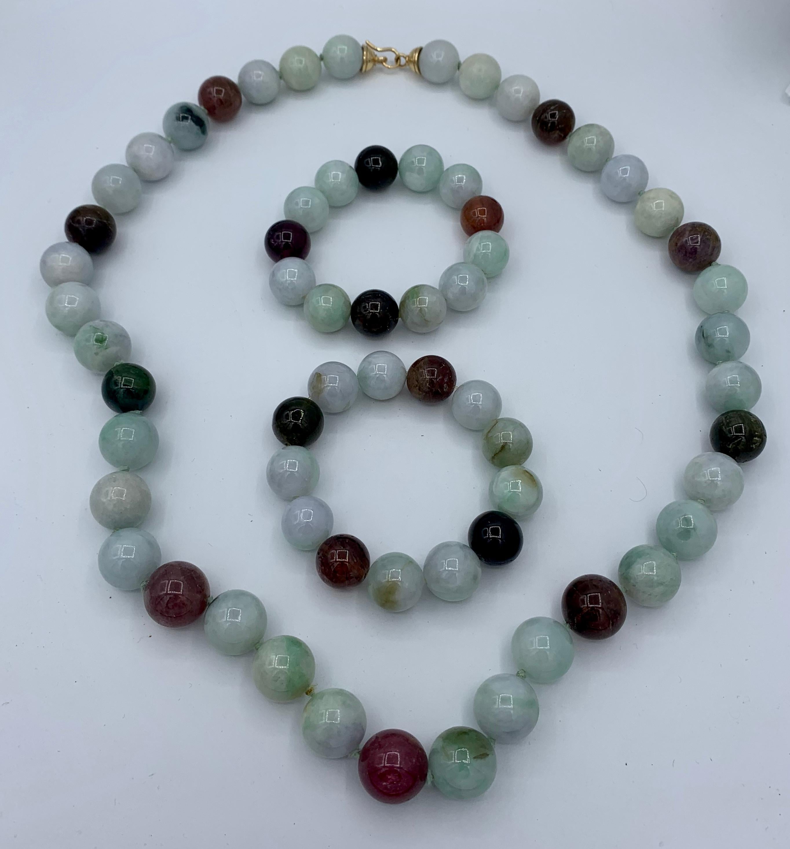 From the estate of legendary writer Barbara Taylor Bradford, OBE (Order of the British Empire), we have a spectacular suite of Jade,  Pink Tourmaline and Green Tourmaline, and 14 Karat Gold, Necklace and pair of Bracelets.  The magnificent necklace