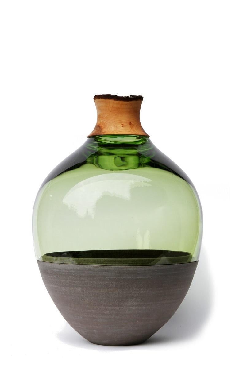 Jade TSV4 stacking vessel, Pia Wüstenberg.
Dimensions: D 34 x H 57.
Materials: glass, wood, ceramic.
Available in other colors.

Handmade in Europe: handblown glass (Czech Republic), ceramic (handmade in Scotland), hand turned wood