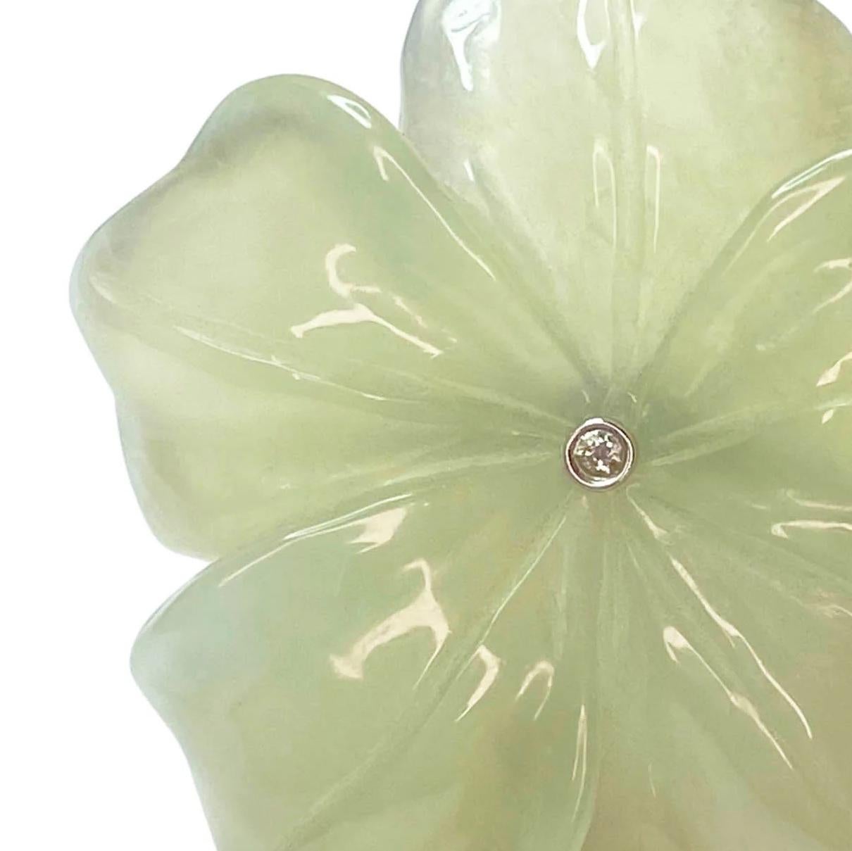 Hand carved Burmese Jade Flower ring with solid hand crafted 18k yellow gold and a White Diamond Centre.

A sculptural beauty,  the Jade Wild Flower and Diamond Double Ring sits beautifully and very comfortably on the hand.
This sophisticated