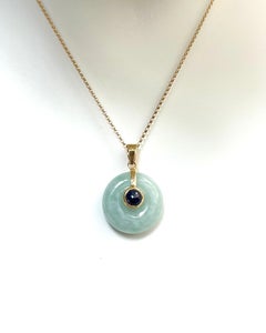 Jade with Cabochon Blue Sapphire Pendant set in 18K Gold Settings