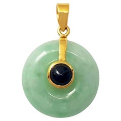 Jade with Cabochon Blue Sapphire Pendant set in 18K Gold Settings