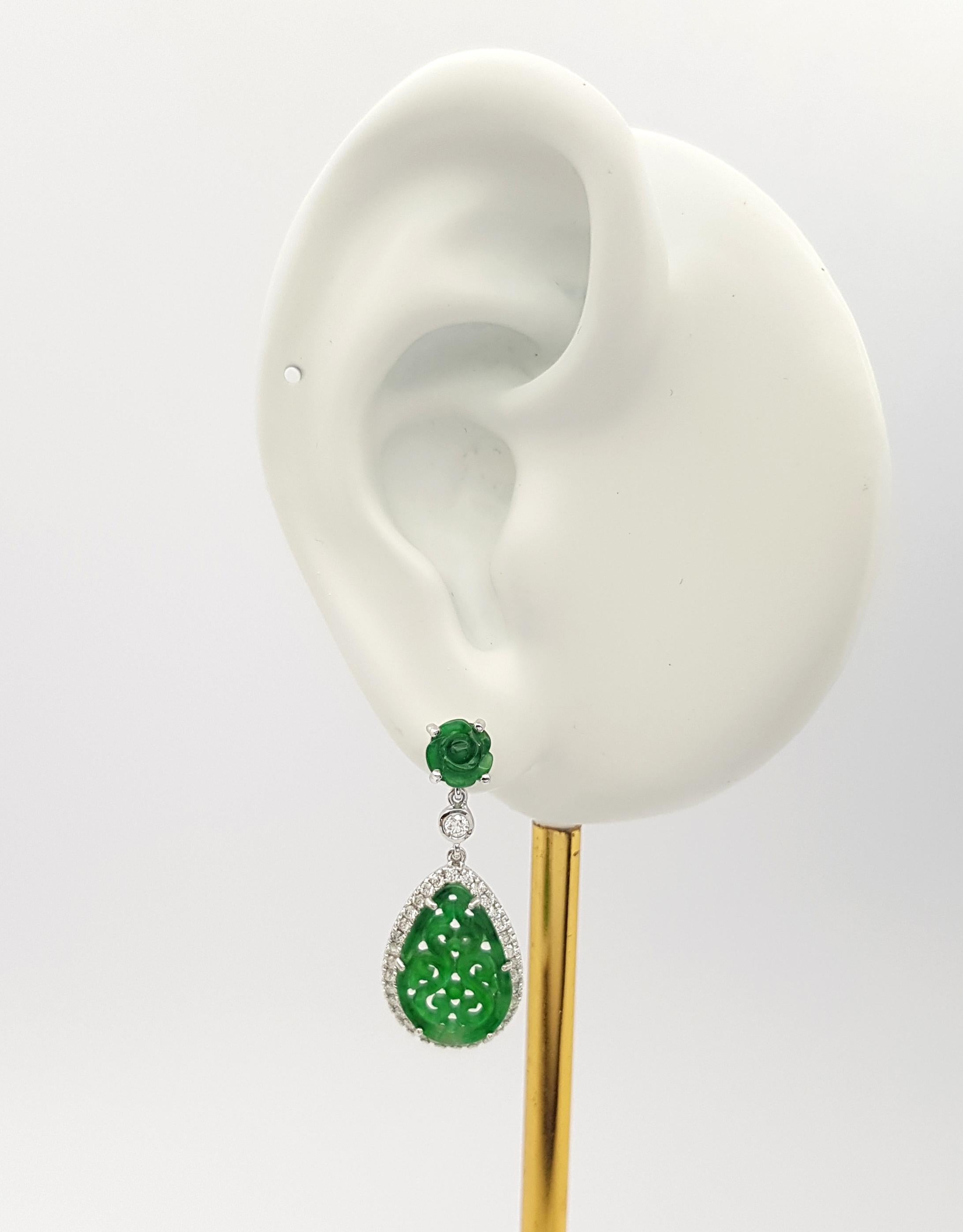 Jade 4.23 carats with Diamond 0.56 carat Earrings set in 18K White Gold Settings

Width: 1.2 cm 
Length: 3.0 cm
Total Weight: 7.14 grams

