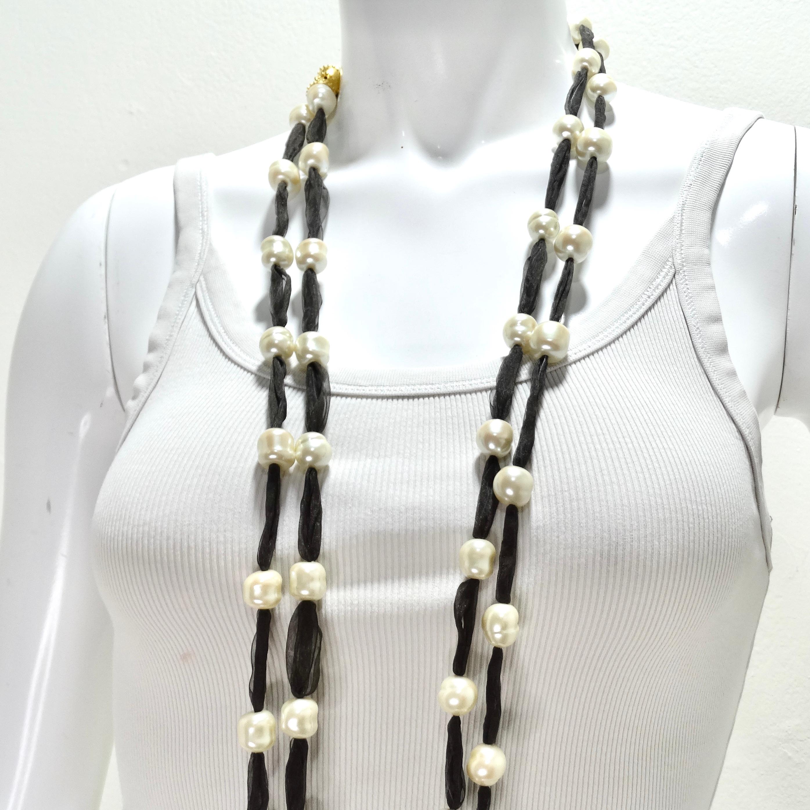 Upgrade your style with the Jaded Jewels Set of 2 Long Freshwater Pearl Ribbon Necklaces, a pair of stunning and versatile necklaces that combine the timeless beauty of freshwater pearls with a dark brown sheer ribbon. The combination of freshwater