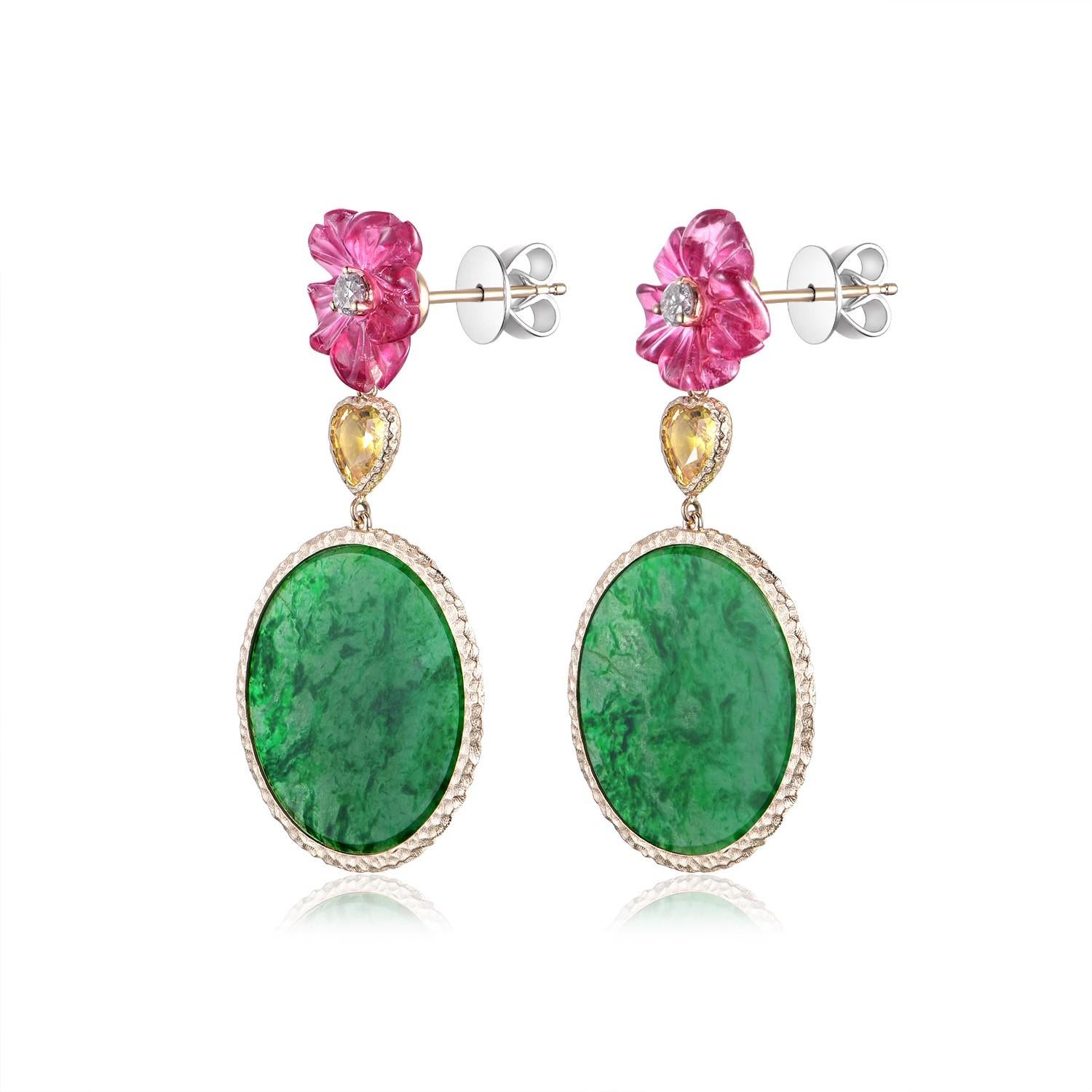 This captivating pair of earrings features a luxurious combination of gemstones set in 14 karat yellow gold. The design is a harmonious blend of color and elegance, with each earring showcasing a substantial 5.95 carat jadeite. The jadeite displays