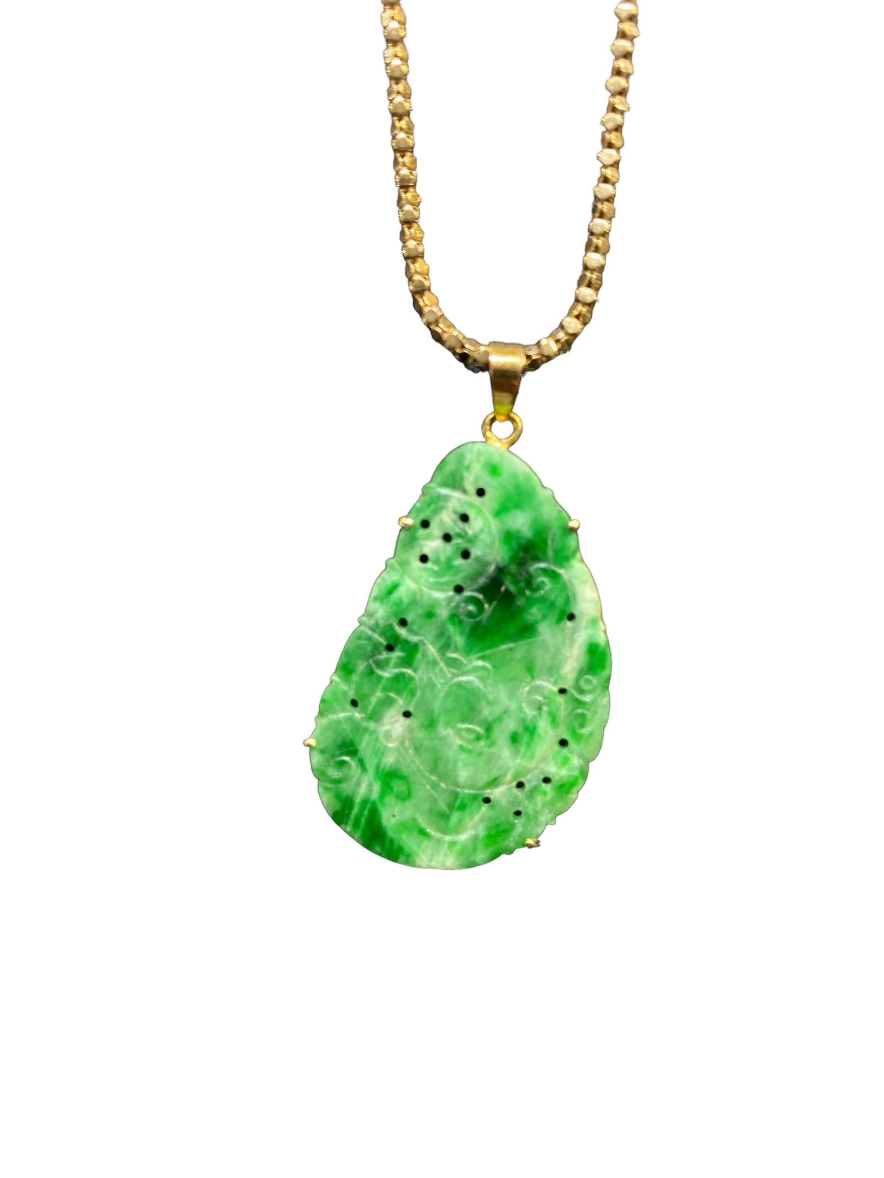 Jadeite Carved Pendant 14K Yellow Gold
The pendant is a beautifully carved jade. The jade is translucent and colored with deep green veins. The carving depicts a star formation, swirls & movement, giving a feeling of peace and tranquility. The jade