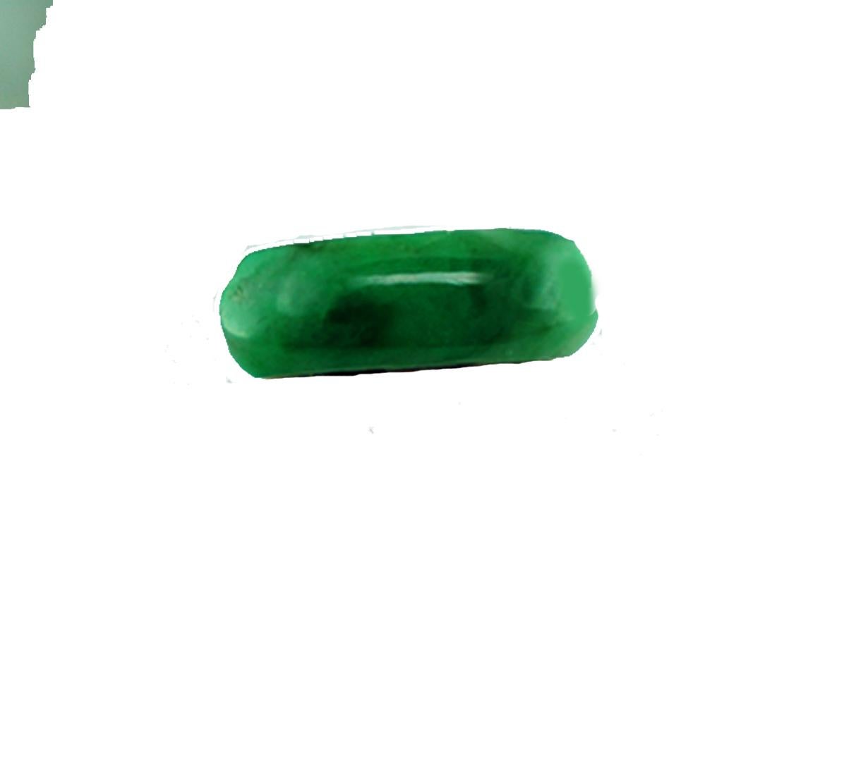 Jadeite Green Jade ring measures 7.40 mm wide and displays a convex cut gemstone. The jade is varied colors of deep veined green to granny-green apple colored 
Measures length of 19 mm wide above the ring.
The height of this ring is 10 mm
The finger