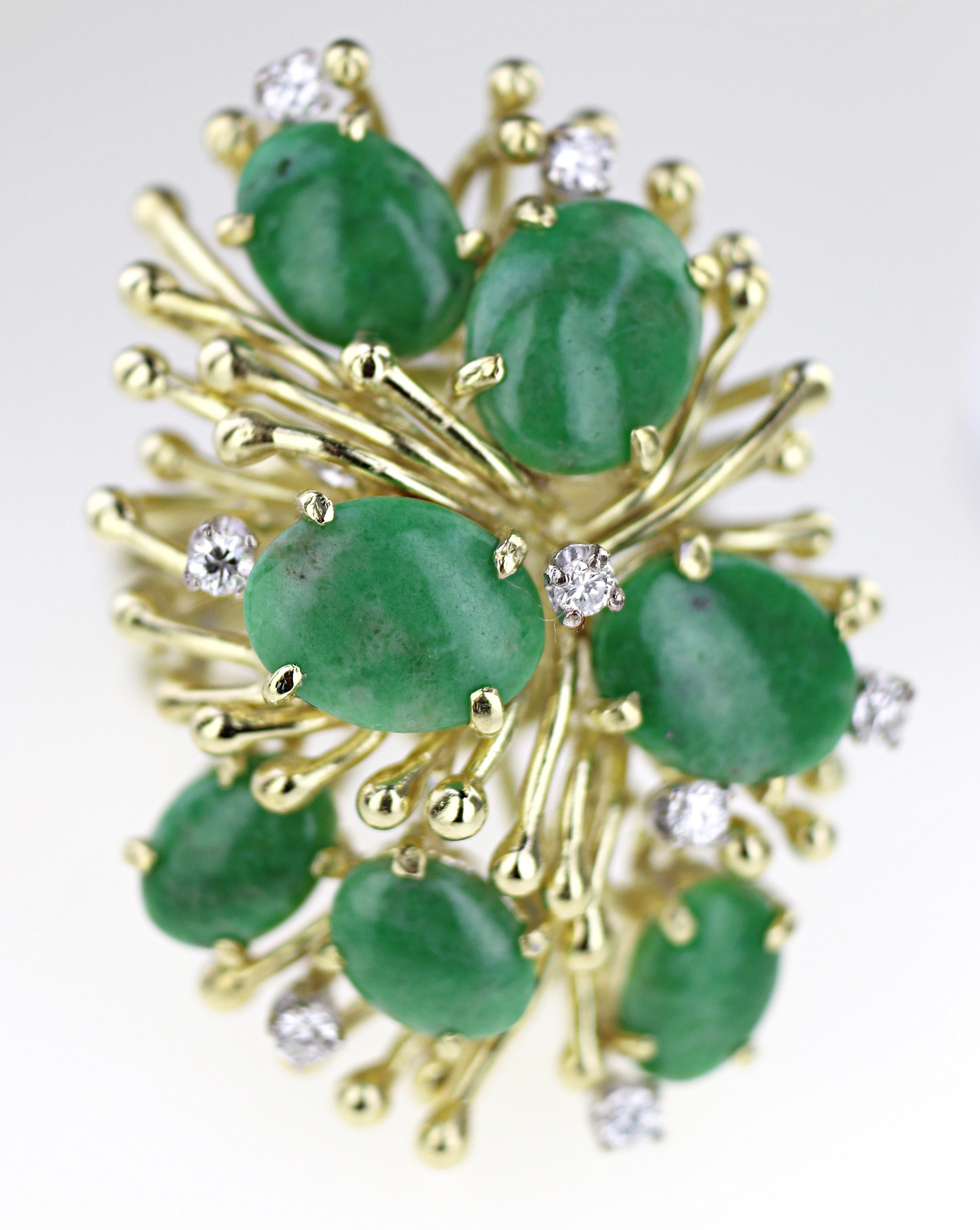 Featuring (7) oval green jadeite Jade cabochons, 9 X 6 mm to 7 X 6 mm, accented by (8) full-cut diamonds, 0.25 ct. tw., I, I-J, set in an 18k yellow gold spray cluster mounting, 35 X 24 X 5.5 mm, marked 18K, size 7*, Gross weight 16.27 grams.
