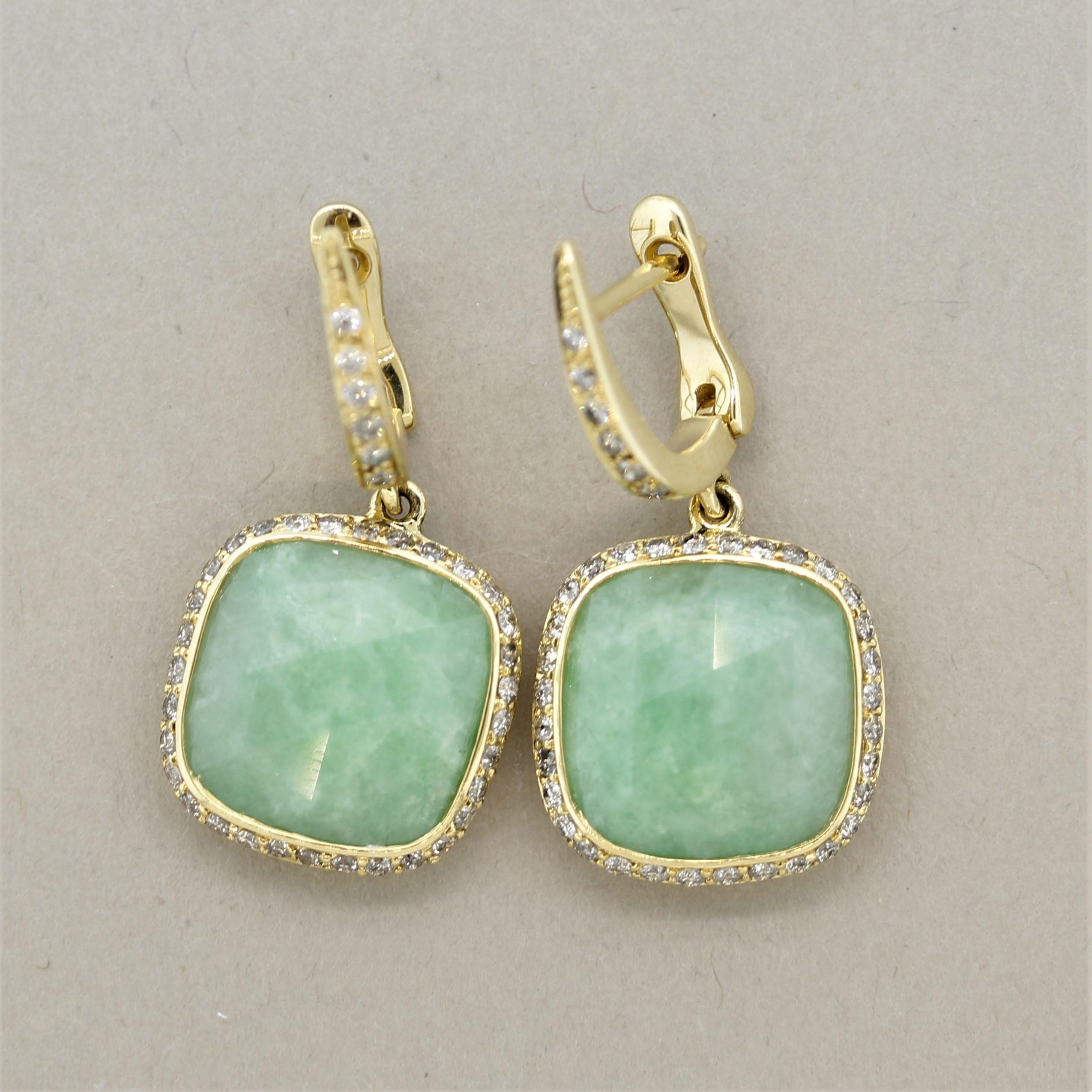A lovely pair of earrings featuring 9.47 carats of natural jadeite jade. They have a pleasing mottled green color and a faceted rose-cut top for an added unique look. They are surrounded by 0.71 carats of round brilliant-cut diamonds which add