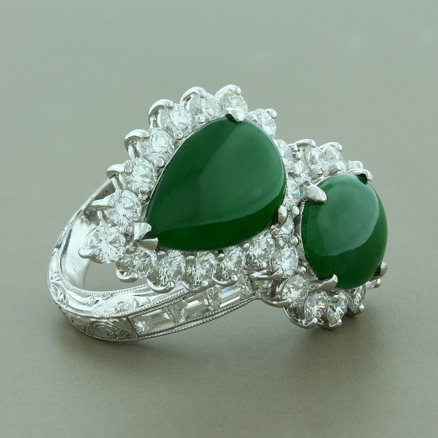 This ring features two captivating GIA certified natural pieces of Type A jadeite jade weighing approximately 10 carats. There is a total of 4 carats of brilliant cut and step cut diamonds which halo the two pieces of jade and are channel set on the