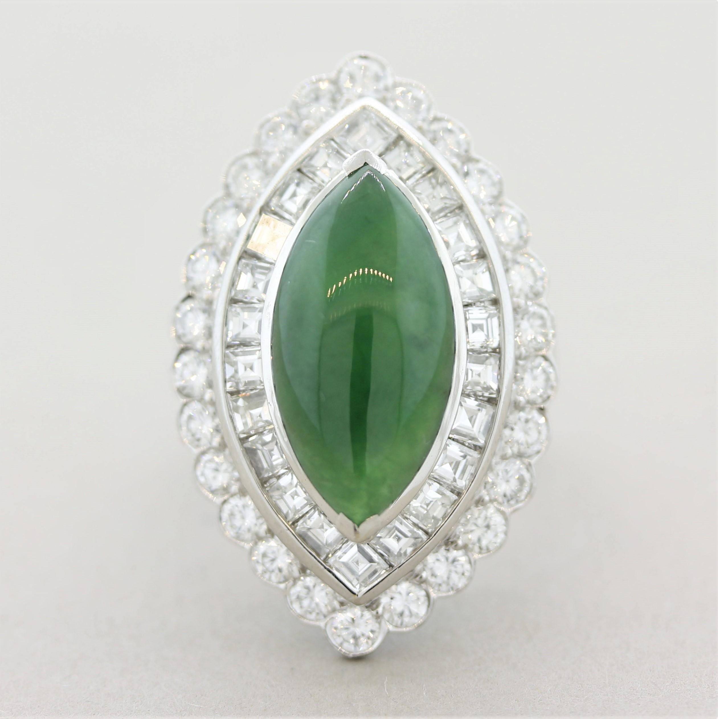 A marquise-shaped natural untreated jade weighing 5.50 carats takes center stage! It has an ideal rich, even green color with excellent luster. It is accented by 3.10 carats of asscher-cut and round brilliant-cut diamonds making a double-halo around