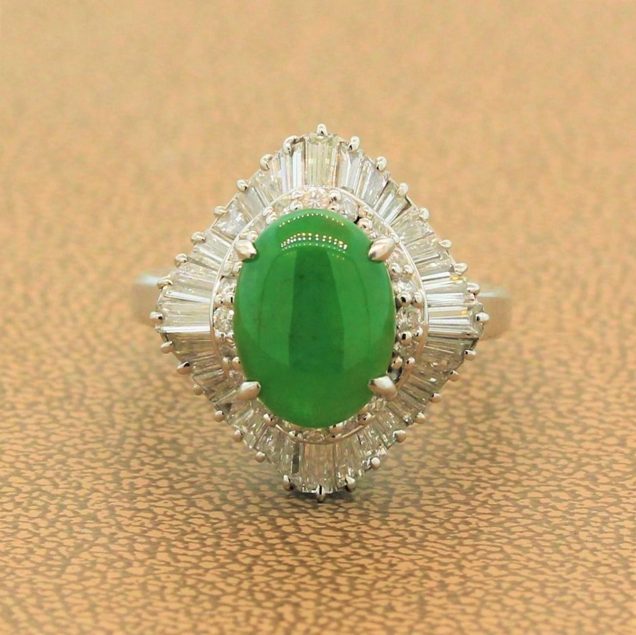 A stunning platinum ring featuring a 3.24 carat green jade. The oval cabochon jade is haloed by a ballerina setting of 1.77 carats of round cut and baguette cut diamonds in a hand fabricated platinum setting.

Ring Size 7.25 (Sizable)
